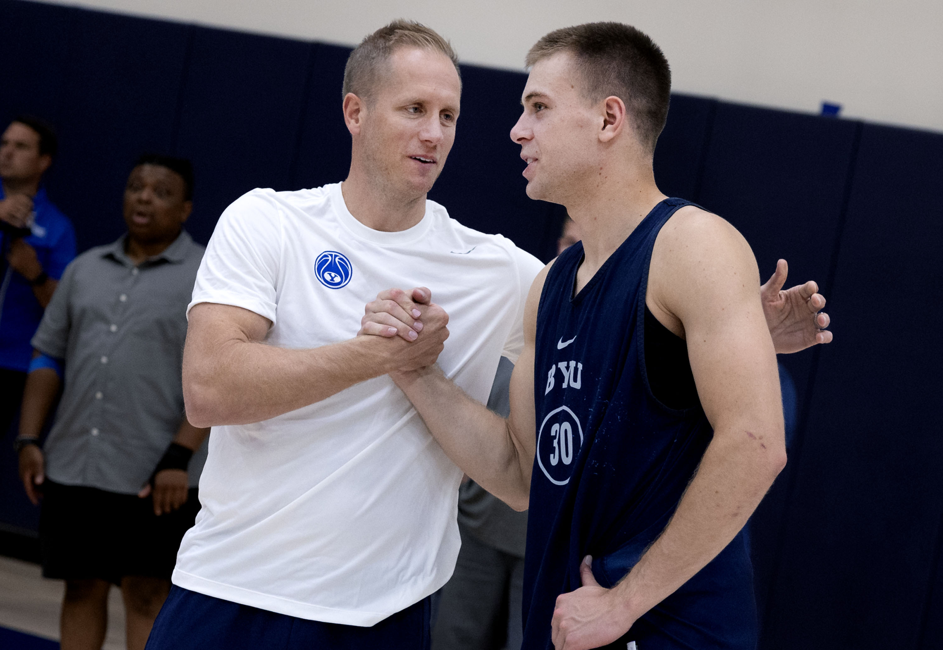 BYU's head men's basketball coach Kevin Young speaks with Dallin Hall after practice at BYU in Provo on Thursday, June 6, 2024.