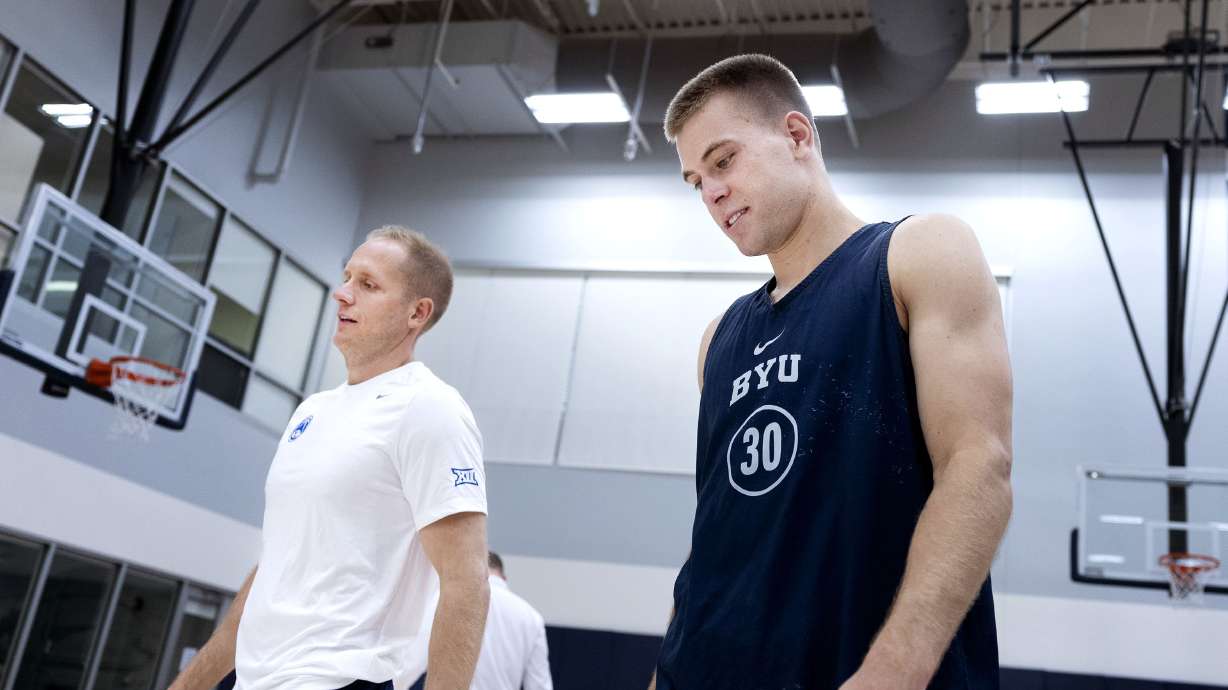 BYU's head men's basketball coach Kevin Young with point guard Dallin Hall after practice at BYU in Provo on Thursday, June 6, 2024.