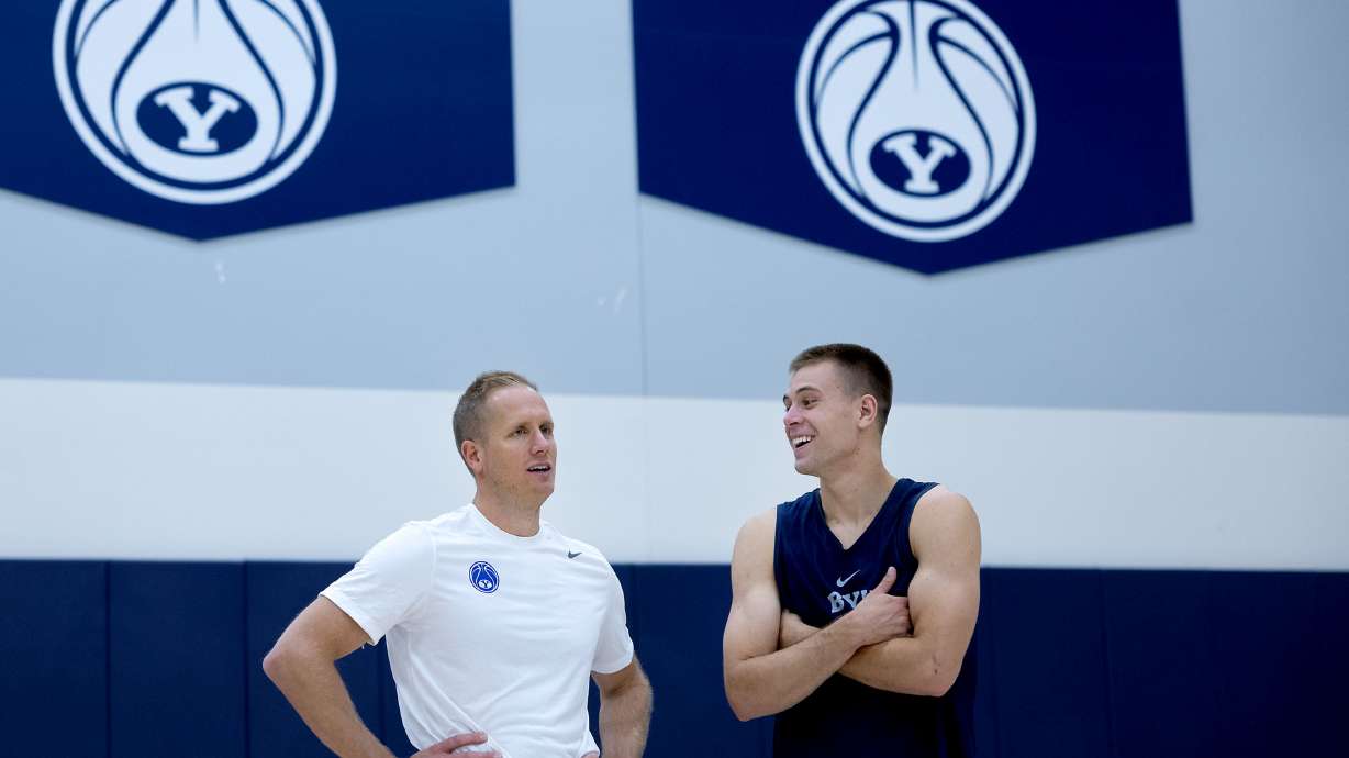 BYU's head men's basketball coach Kevin Young with point guard Dallin Hall after practice at BYU in Provo on Thursday, June 6, 2024.
