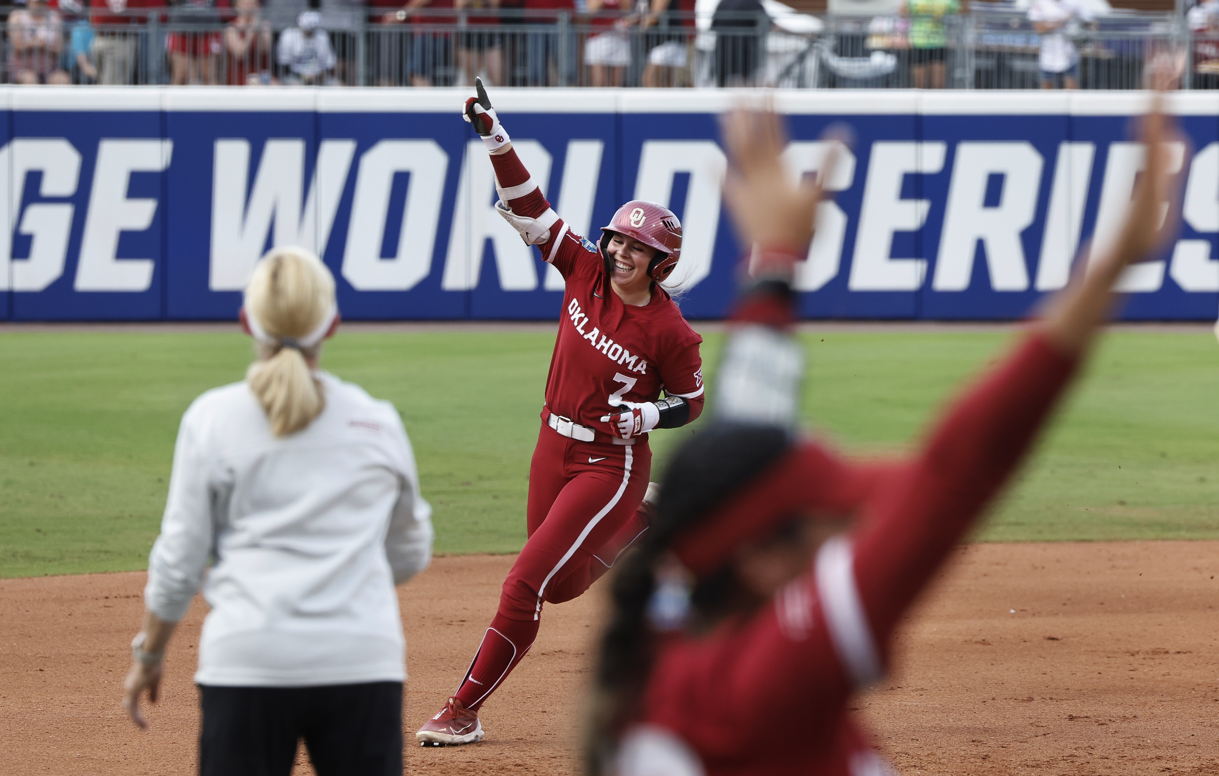 Oklahoma's Kasidi Pickering (7) celebrates a home run against Texas during the second inning of Game 2 of the NCAA Women's College World Series softball championship series Thursday, June 6, 2024, in Oklahoma City. 