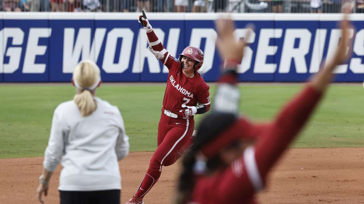 Oklahoma's Kasidi Pickering (7) celebrates a home run against Texas during the second inning of Game 2 of the NCAA Women's College World Series softball championship series Thursday, June 6, 2024, in Oklahoma City.