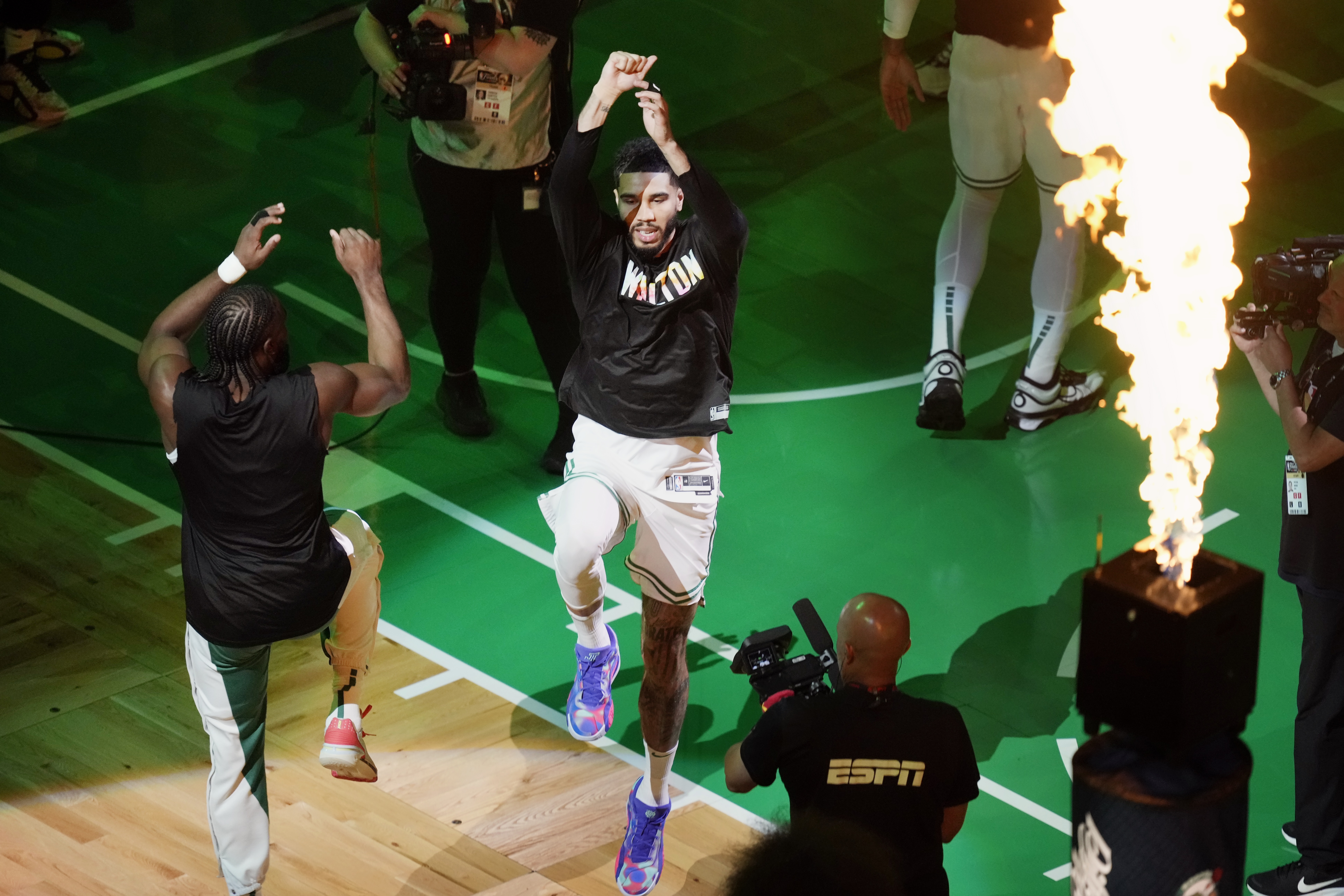 Boston Celtics' Jaylen Brown, left, and Jayson Tatum jump before Game 1 of the basketball team's NBA Finals against the Dallas Mavericks on Thursday, June 6, 2024, in Boston. 