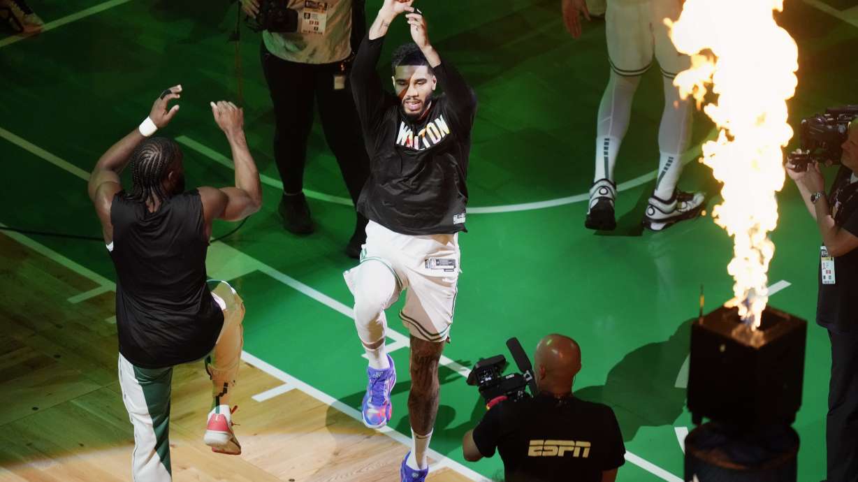 Boston Celtics' Jaylen Brown, left, and Jayson Tatum jump before Game 1 of the basketball team's NBA Finals against the Dallas Mavericks on Thursday, June 6, 2024, in Boston.