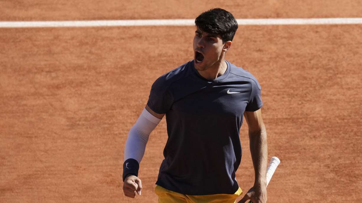 Spain's Carlos Alcaraz reacts during his semifinal match of the French Open tennis tournament against Italy's Jannik Sinner at the Roland Garros stadium in Paris, Friday, June 7, 2024.