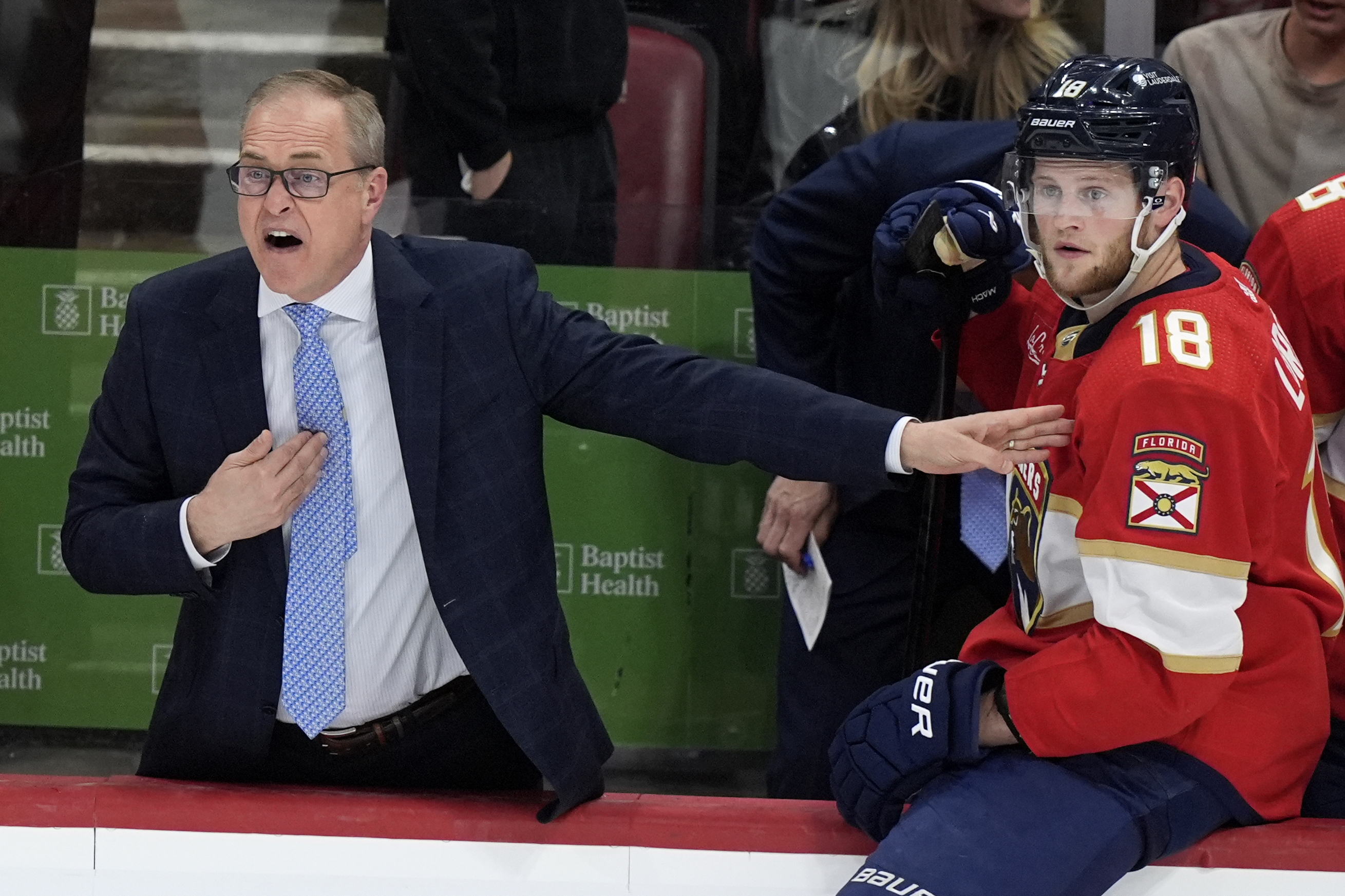 Florida Panthers coach Paul Maurice reacts during the third period of Game 2 against the Boston Bruins in a second-round series of the NHL hockey Stanley Cup playoffs Wednesday, May 8, 2024, in Sunrise, Fla. At right is center Steven Lorentz (18). 