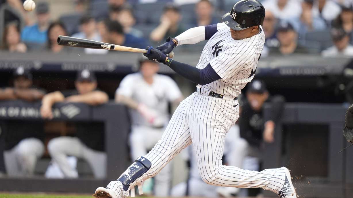 New York Yankees' Juan Soto hits a single against the Minnesota Twins during the first inning of a baseball game Wednesday, June 5, 2024, in New York.