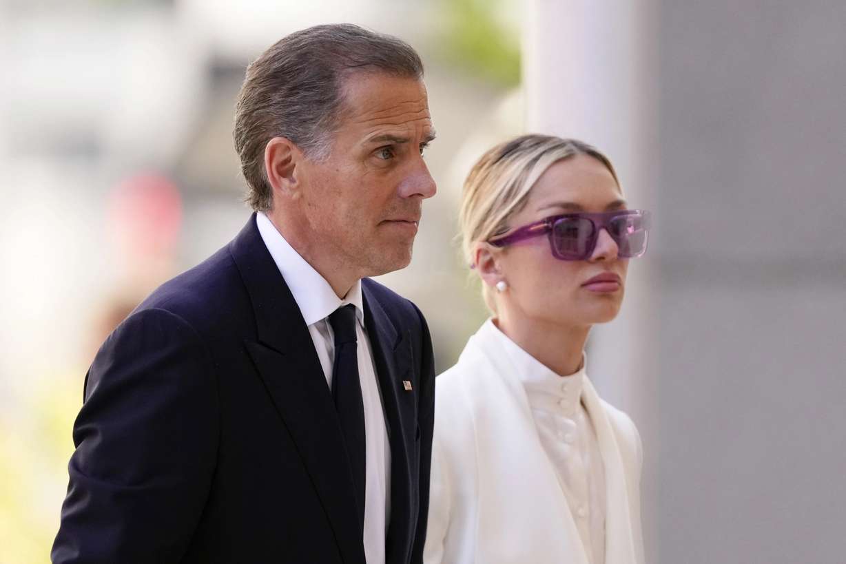 Hunter Biden, left, arrives at federal court with his wife, Melissa Biden, in Wilmington, Del., on Friday.