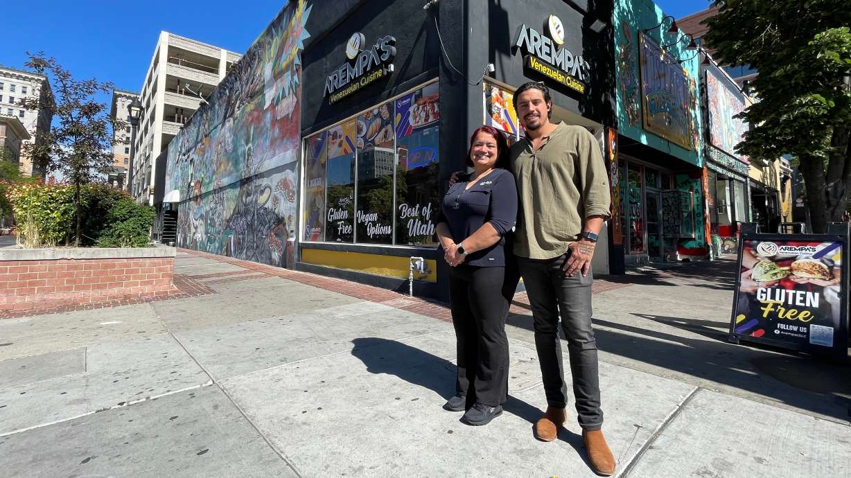 Sandy Arrieta, left, and son Erick Pernia outside the Salt Lake City Arempas location, the family business on Thursday.