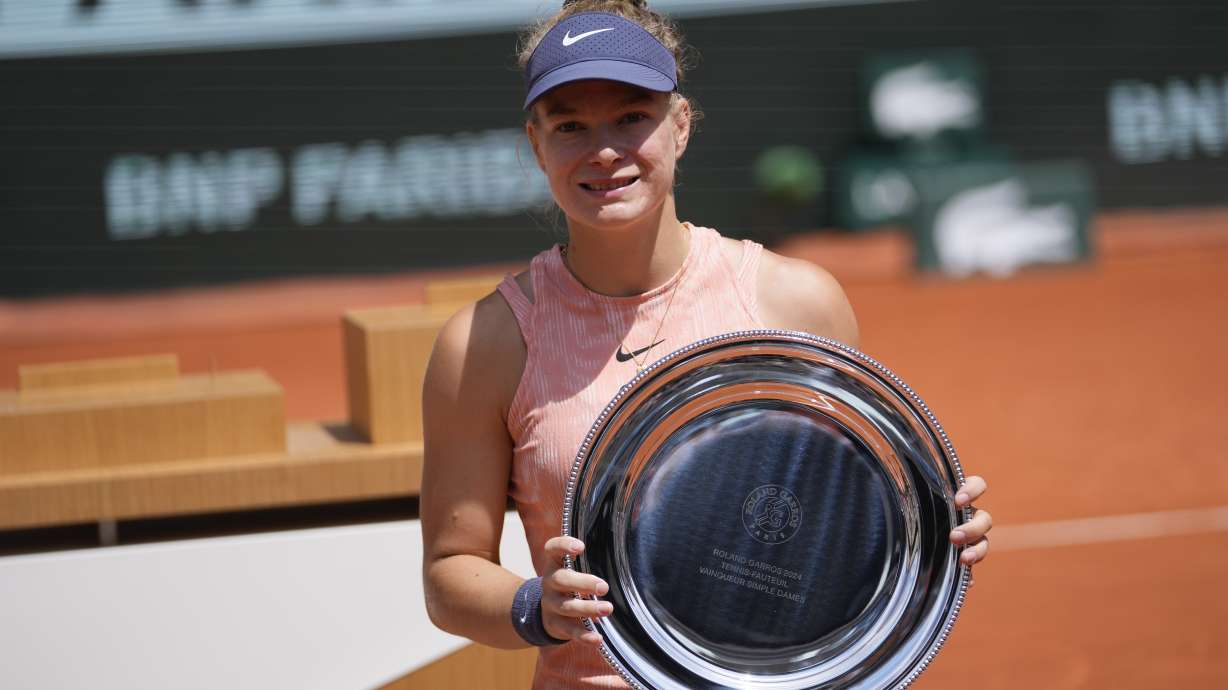 Netherlands' Diede de Groot holds the trophy after winning against China's Zhang Zhizhen in the women's wheelchair final match of the French Open tennis tournament at the Roland Garros stadium in Paris, France, Saturday, June 8, 2024.