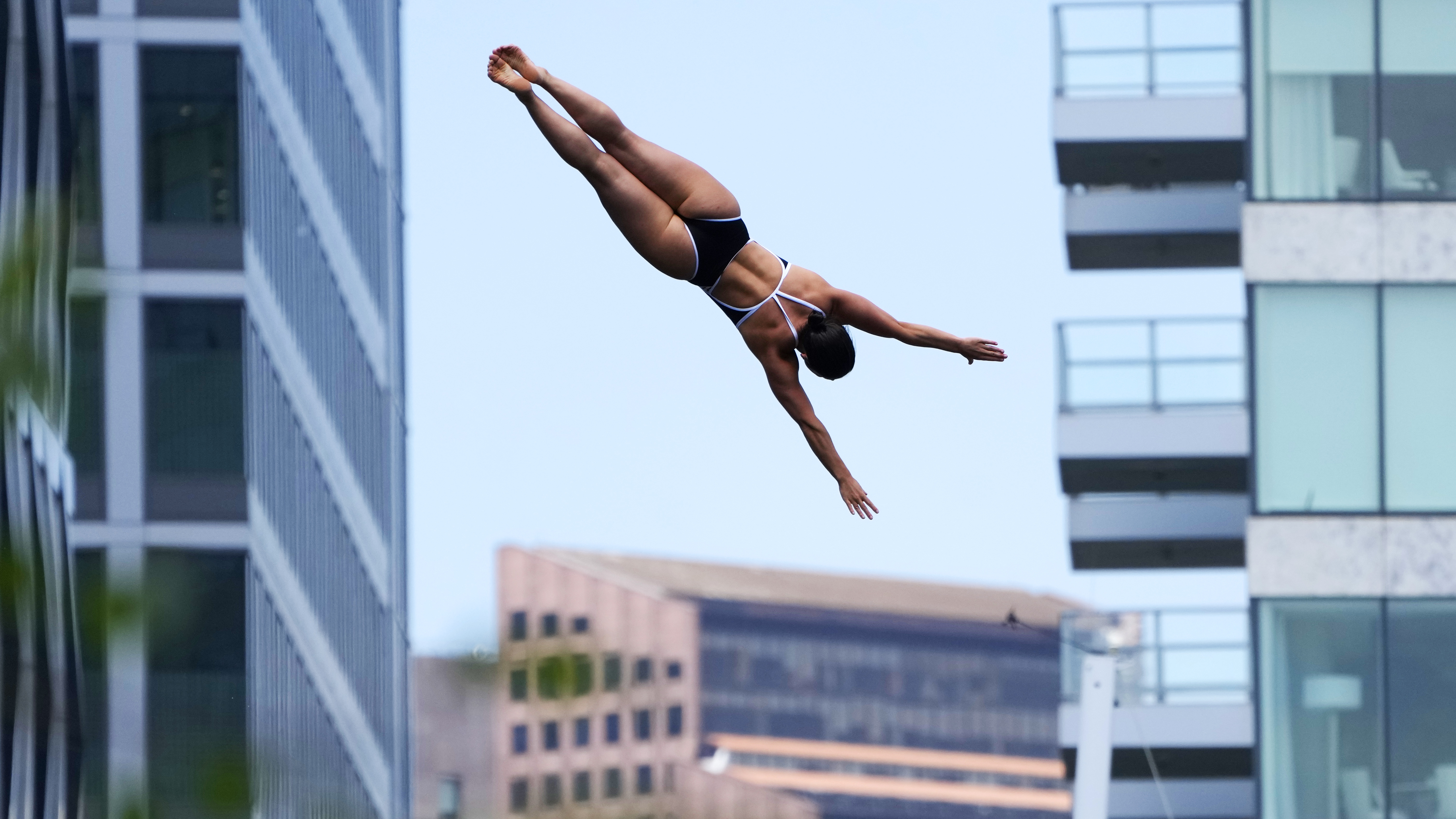 Morgane Herculano, of Switzerland, competes at the Cliff Diving World Series on Boston Harbor, Friday, June 7, 2024, in Boston. 