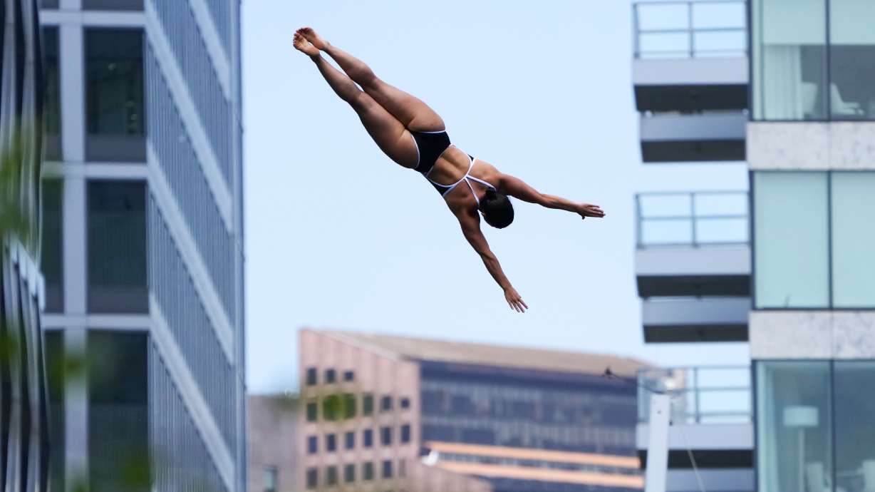 Morgane Herculano, of Switzerland, competes at the Cliff Diving World Series on Boston Harbor, Friday, June 7, 2024, in Boston.