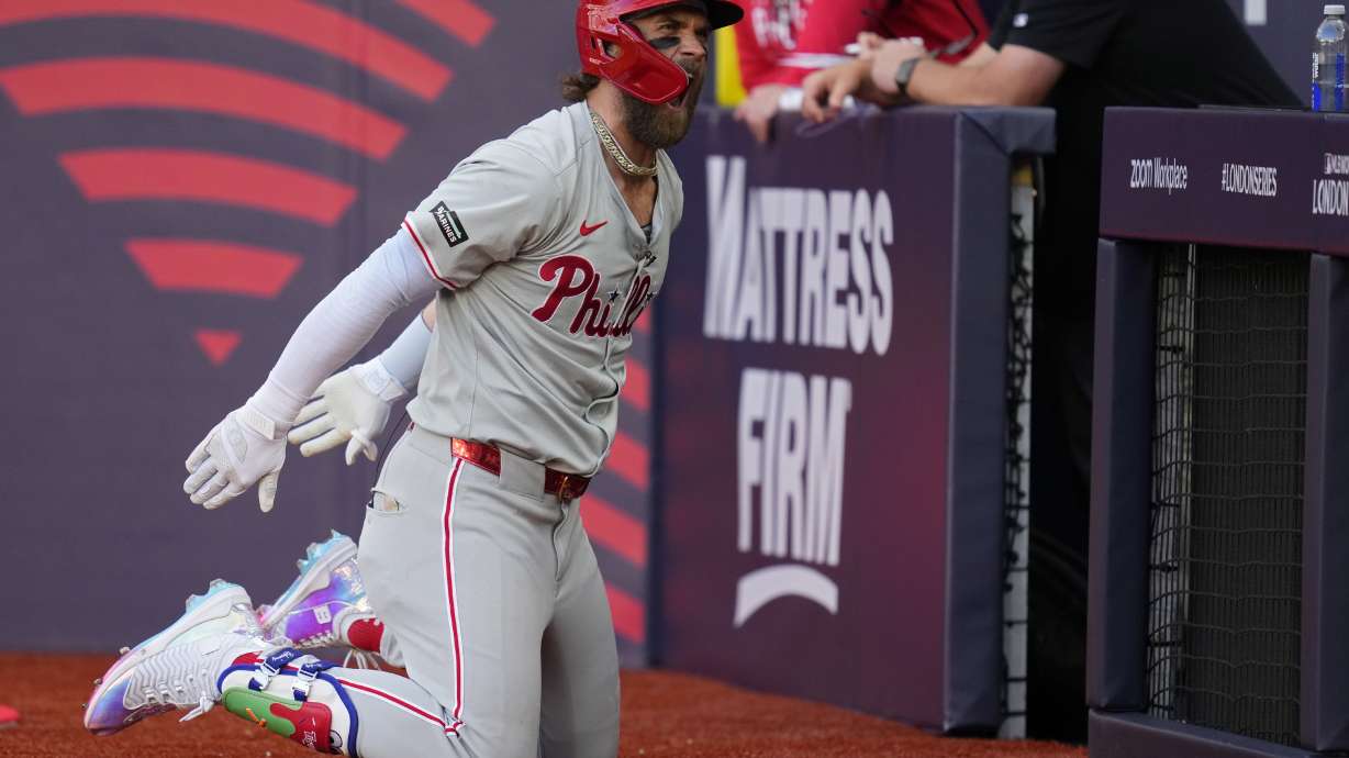 Philadelphia Phillies' Bryce Harper (3) celebrates after hitting a home run against the New York Mets during the fourth inning of a London Series baseball game in London, Saturday, June 8, 2024.