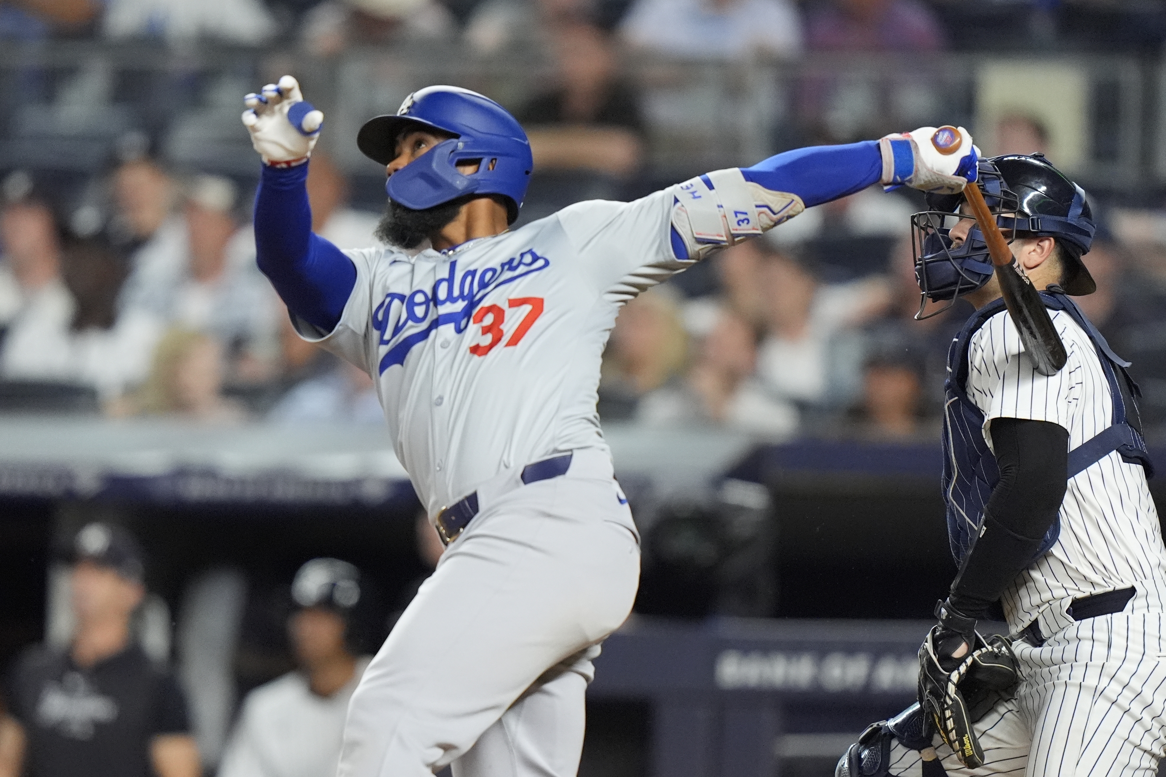 Los Angeles Dodgers' Teoscar Hernández (37) hits a grand slam during the eighth inning of a baseball game against the New York Yankees, Saturday, June 8, 2024, in New York. 