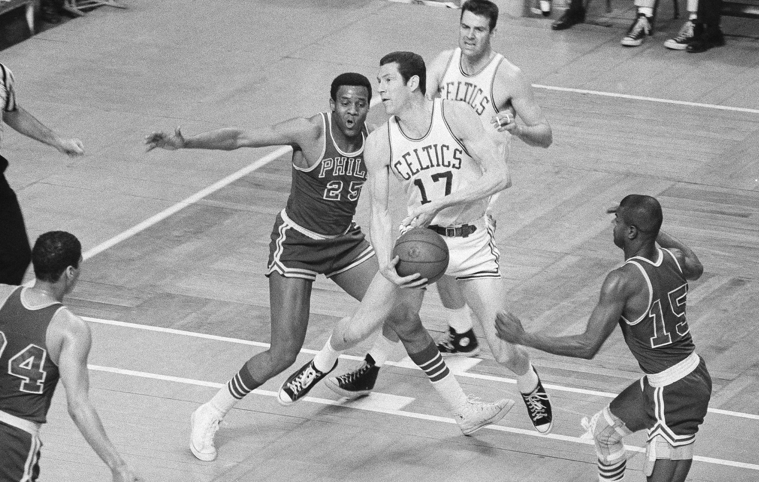 FILE - Boston Celtics' John Havlicek (17) is defended by Philadelphia 76ers' Chet Walker (25) during the first half of an NBA basketball playoff game April 14, 1968, in Boston. Walker, a seven-time All-Star forward who helped Wilt Chamberlain and the 76ers win the 1967 NBA title, has died. He was 84. The National Basketball Players Association confirmed Walker's death, according to NBA.com. The 76ers, Chicago Bulls and National Basketball Retired Players Association also extended their condolences on social media on Saturday, June 8, 2024. 