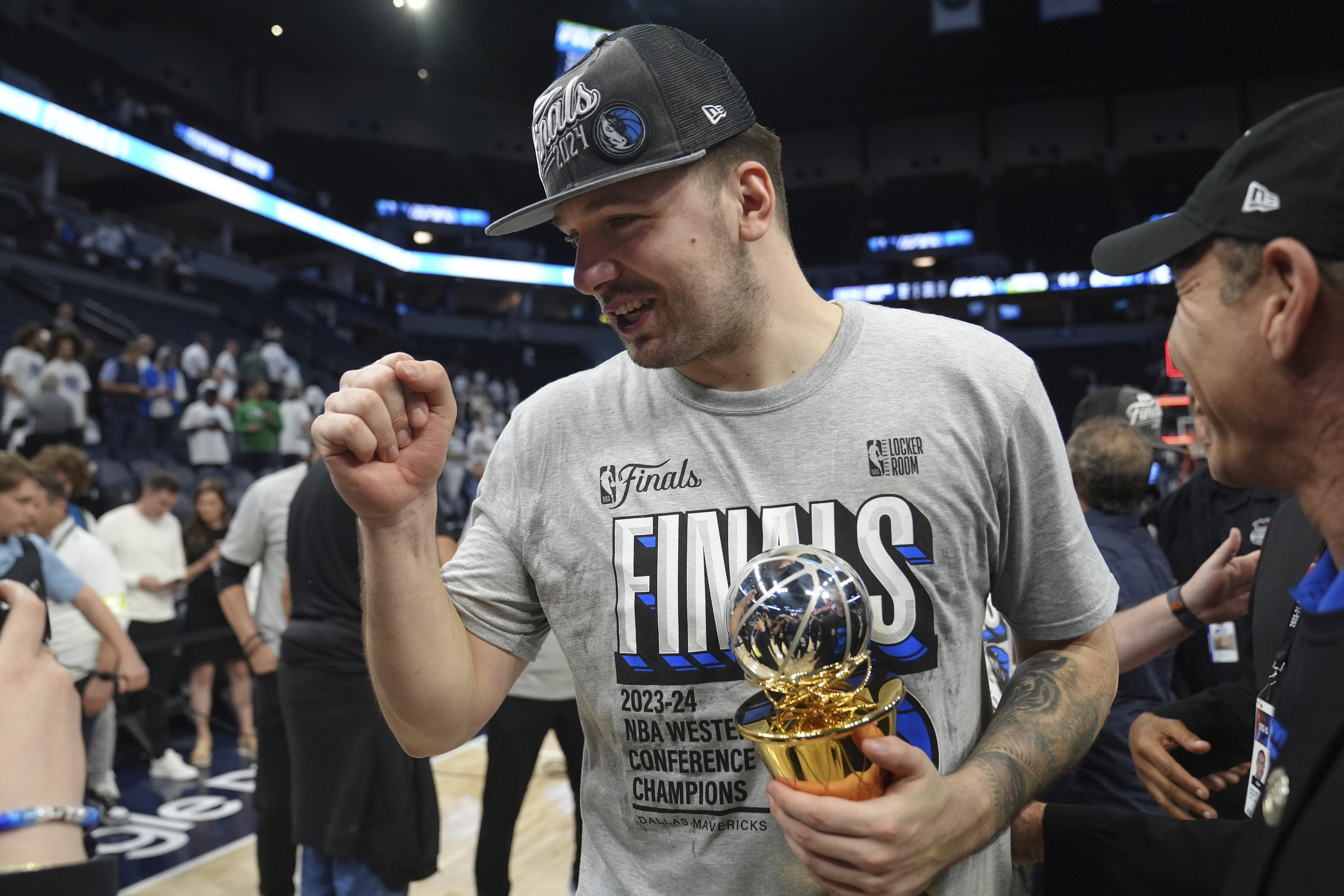 Dallas Mavericks guard Luka Doncic celebrates the team's win over the Minnesota Timberwolves in Game 5 of the Western Conference finals in the NBA basketball playoffs Thursday, May 30, 2024, in Minneapolis. The Mavericks won 124-103, taking the series 4-1 and moving on to the NBA Finals. 
