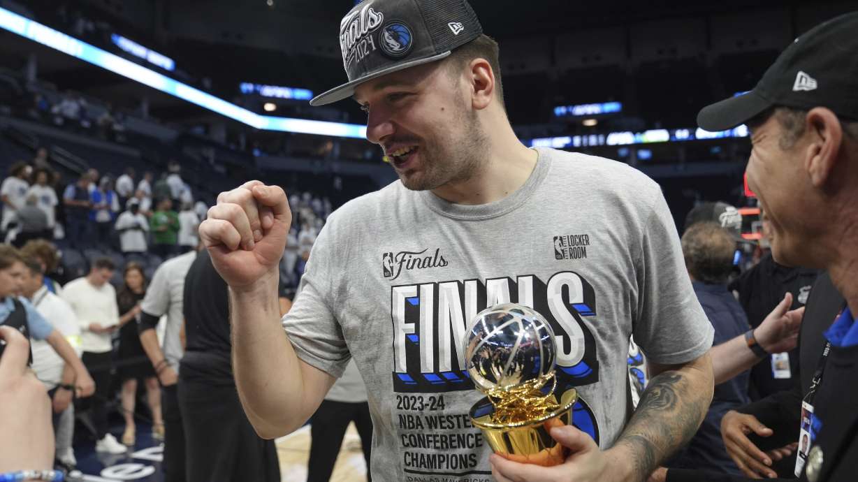 Dallas Mavericks guard Luka Doncic celebrates the team's win over the Minnesota Timberwolves in Game 5 of the Western Conference finals in the NBA basketball playoffs Thursday, May 30, 2024, in Minneapolis. The Mavericks won 124-103, taking the series 4-1 and moving on to the NBA Finals.