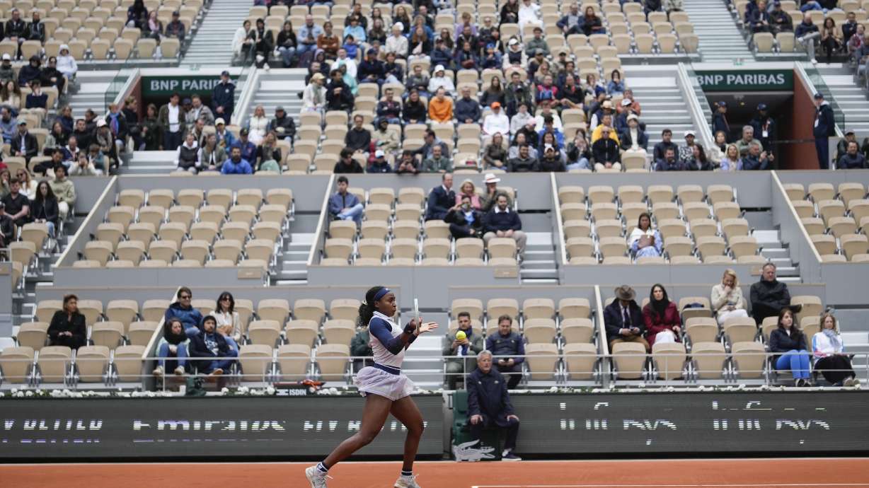 Empty seats in center court Philippe Chatrier are seen as Coco Gauff of the U.S. plays a shot against Italy's Elisabetta Cocciaretto during their fourth round match of the French Open tennis tournament at the Roland Garros stadium in Paris, Sunday, June 2, 2024.