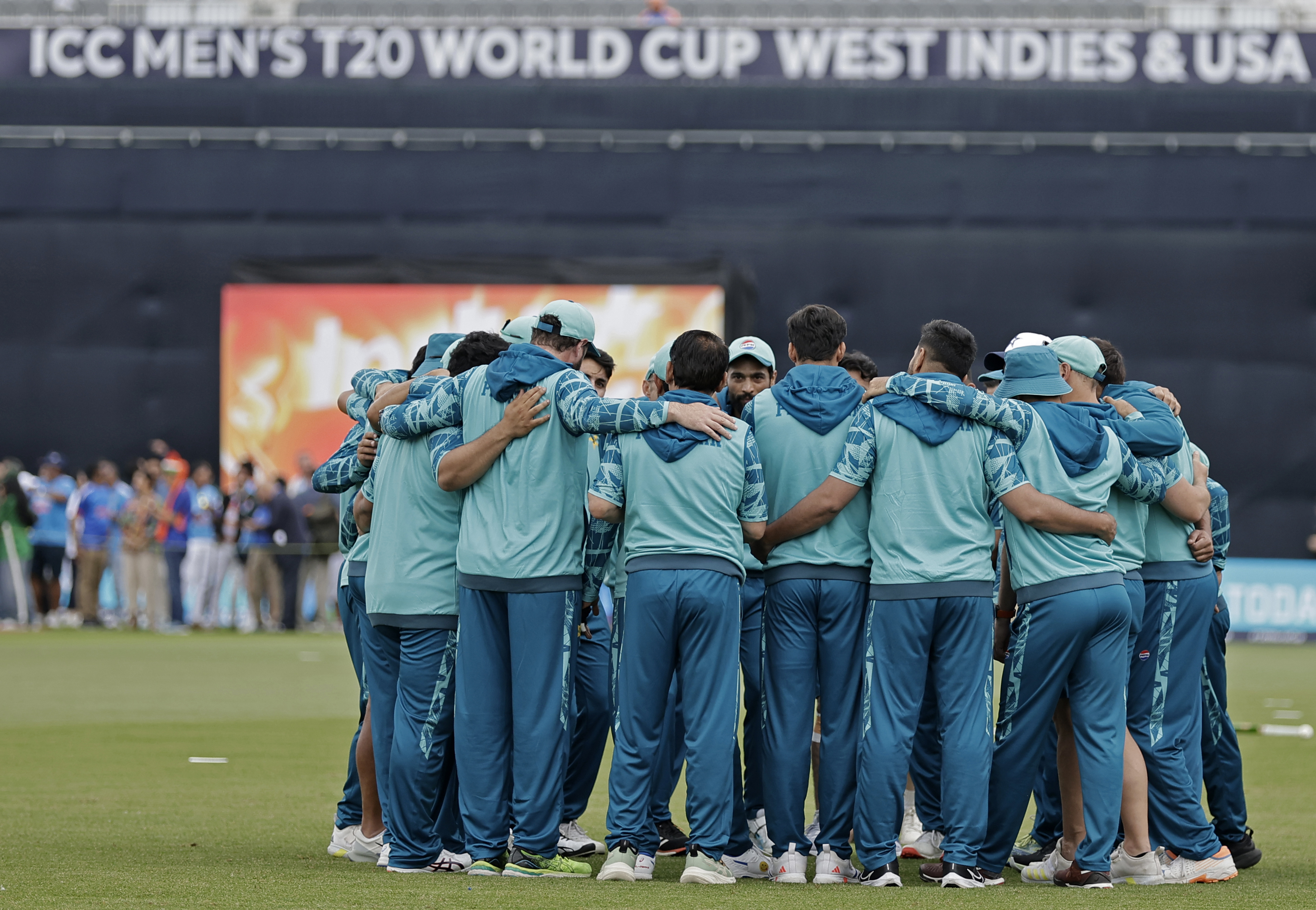 Pakistan players stand in a huddle prior to the start of the ICC Men's T20 World Cup cricket match between India and Pakistan at the Nassau County International Cricket Stadium in Westbury, New York, Sunday, June 9, 2024. 