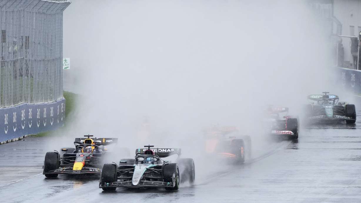 Mercedes driver George Russell, second from left, of the United Kingdom, leads as Red Bull driver Max Verstappen, of The Netherlands, drives during the Canadian Grand Prix Formula 1 car race, in Montreal, Sunday, June 9, 2024.
