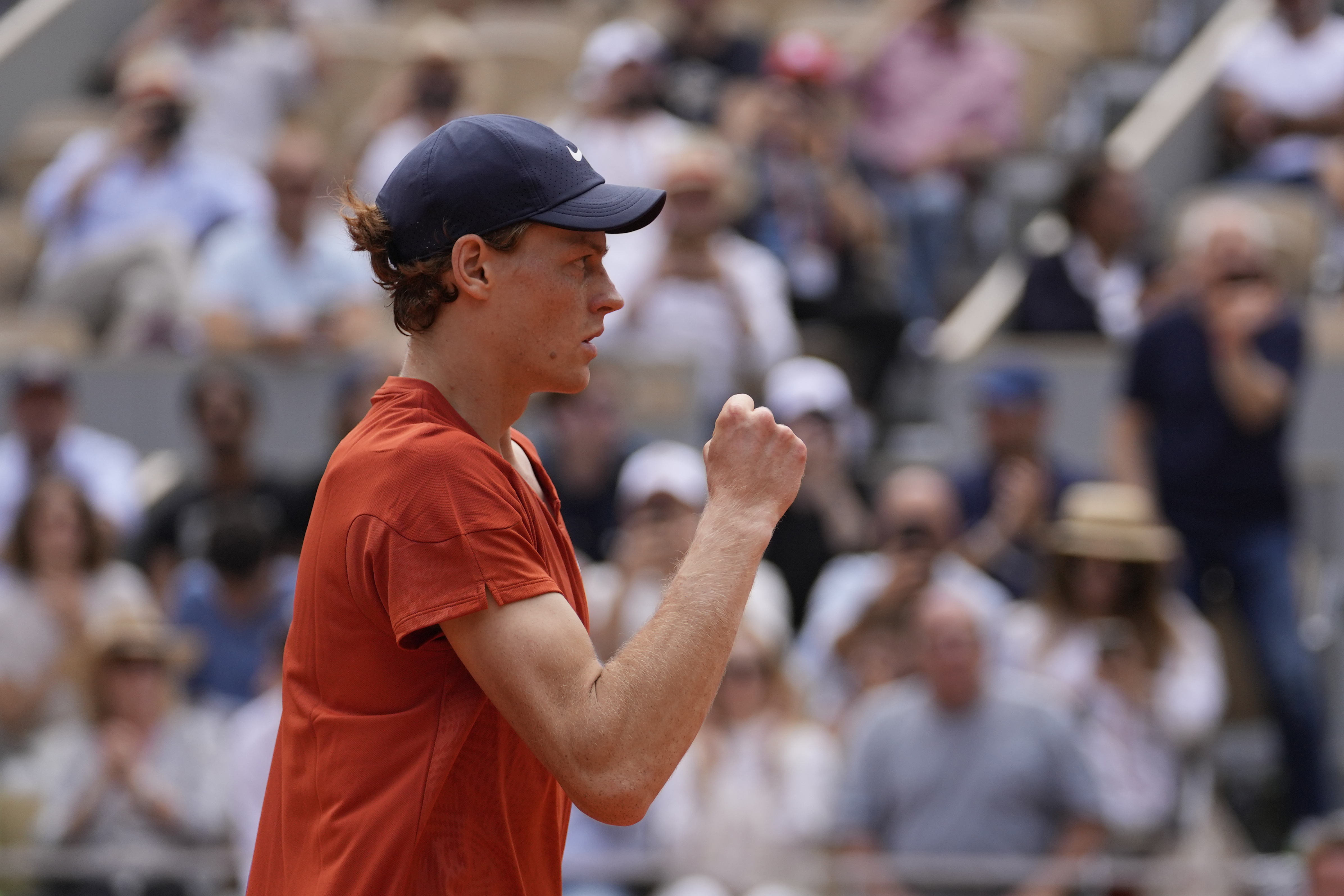 Italy's Jannik Sinner celebrates as he won the quarterfinal match of the French Open tennis tournament against Bulgaria's Grigor Dimitrov at the Roland Garros stadium in Paris, Tuesday, June 4, 2024.