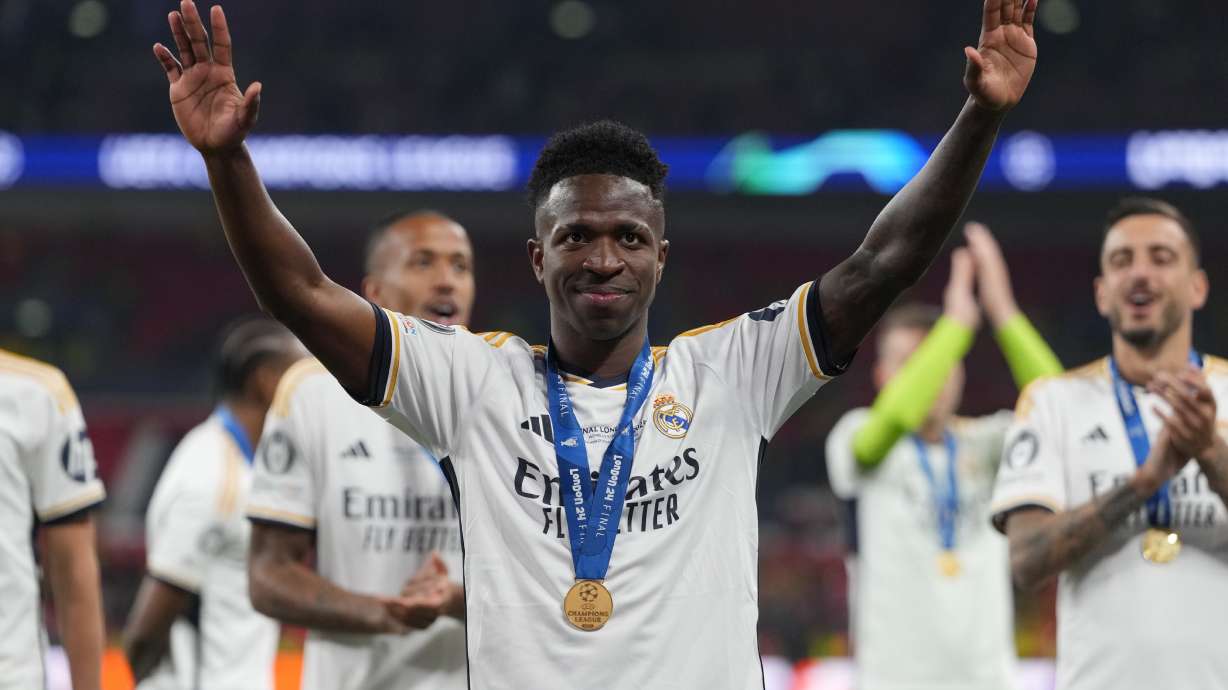 Real Madrid's Vinicius Junior waves after winning the Champions League final soccer match between Borussia Dortmund and Real Madrid at Wembley stadium in London, Saturday, June 1, 2024.
