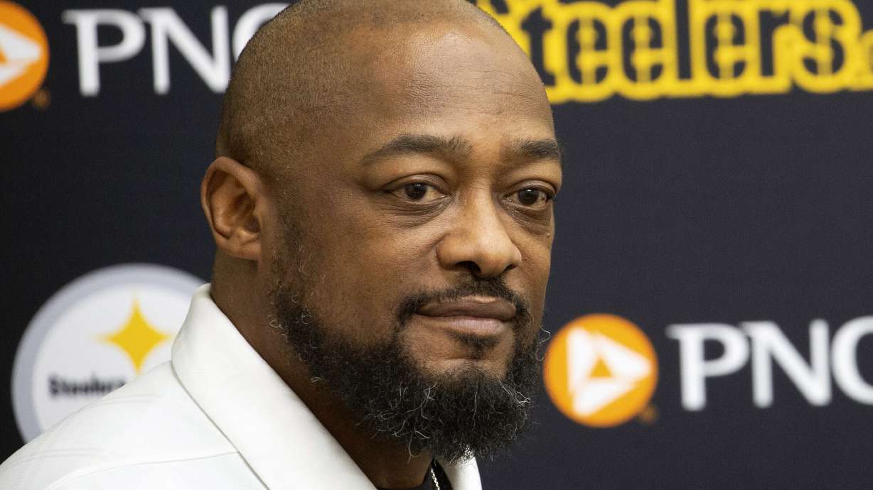 FILE - Pittsburgh Steelers head coach Mike Tomlin listens during a press conference in Pittsburgh, Friday, March 15, 2024. Tomlin signed an extension with the Steelers on Monday, June 10, that will keep the NFL's longest-tenured coach in Pittsburgh through at least 2027.