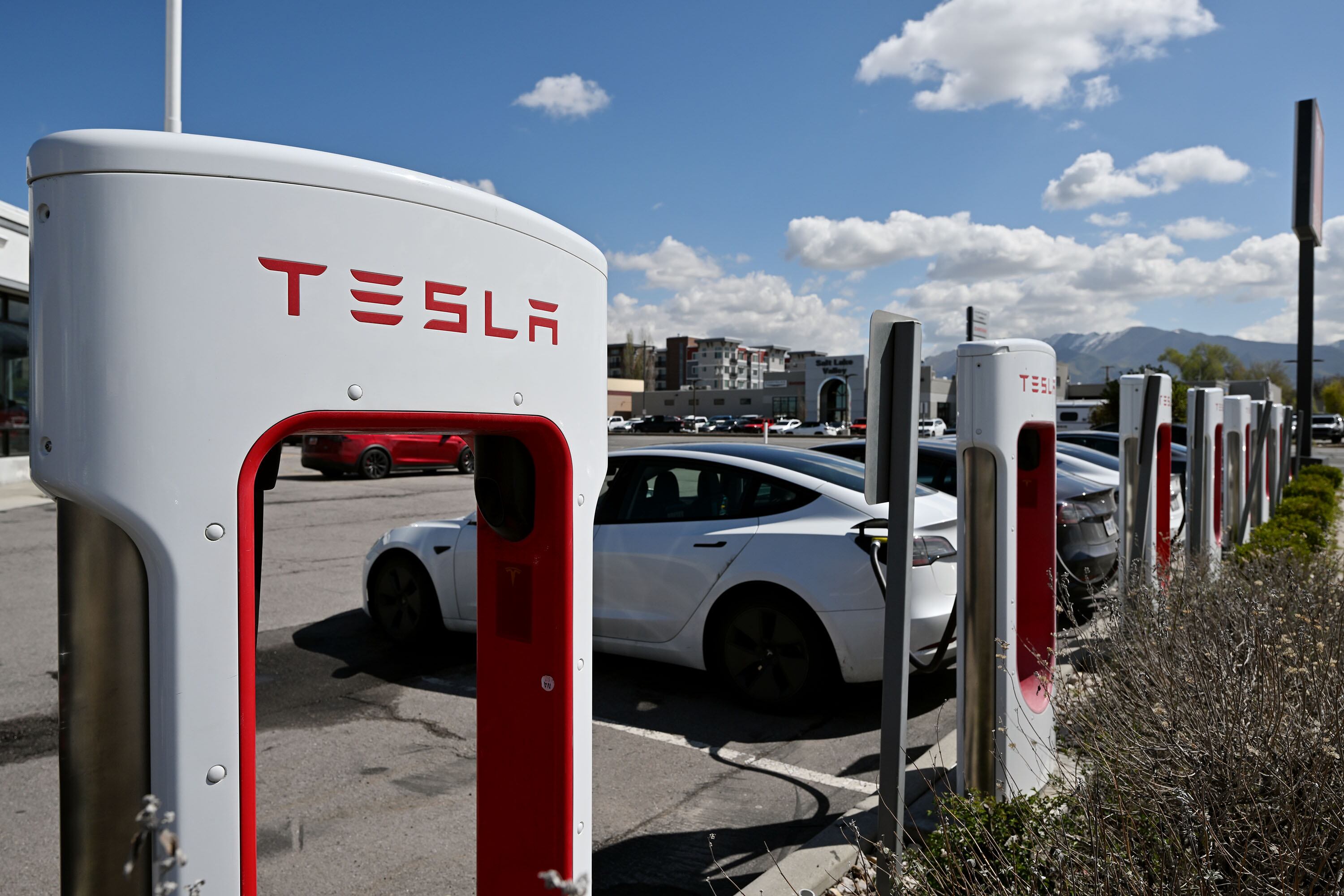 Tesla chargers are pictured at the dealership in Salt Lake City on April 16. A recent AAA survey found that Americans are less attracted to switching out their gas gusler for an electric vehicle than last year.