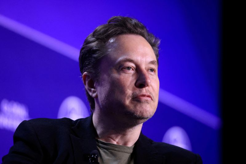 Elon Musk speaks at the Milken Conference 2024 Global Conference Sessions in Beverly Hills, Calif., May 6. Musk said he would ban Apple devices at his companies if the iPhone maker integrates OpenAI at the operating system level.