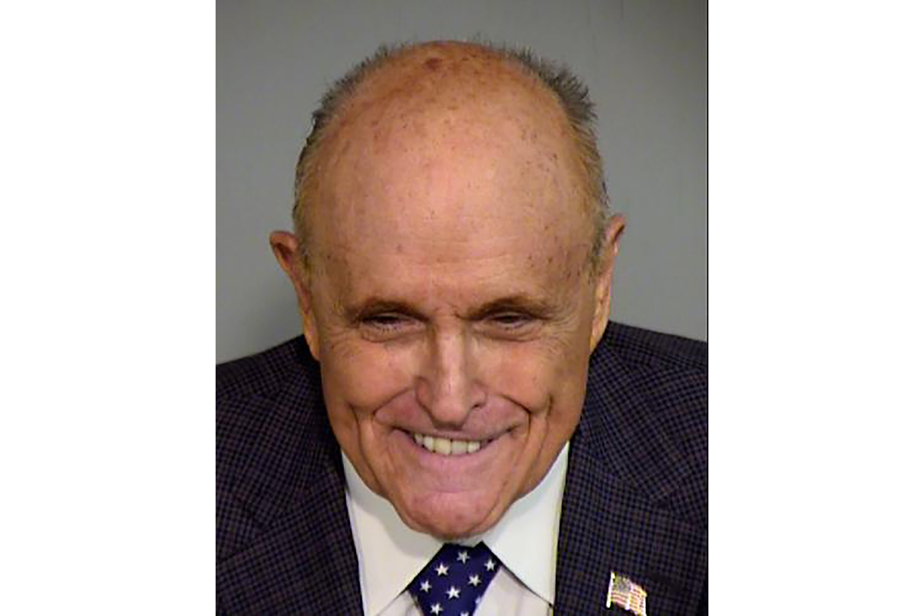 This photo released by the Maricopa County, Ariz., Sheriff's Office on Monday, shows former New York City mayor and Donald Trump attorney Rudy Giuliani. Giuliani was processed Monday in the criminal case over the effort to overturn Trump’s Arizona election loss to Joe Biden. 