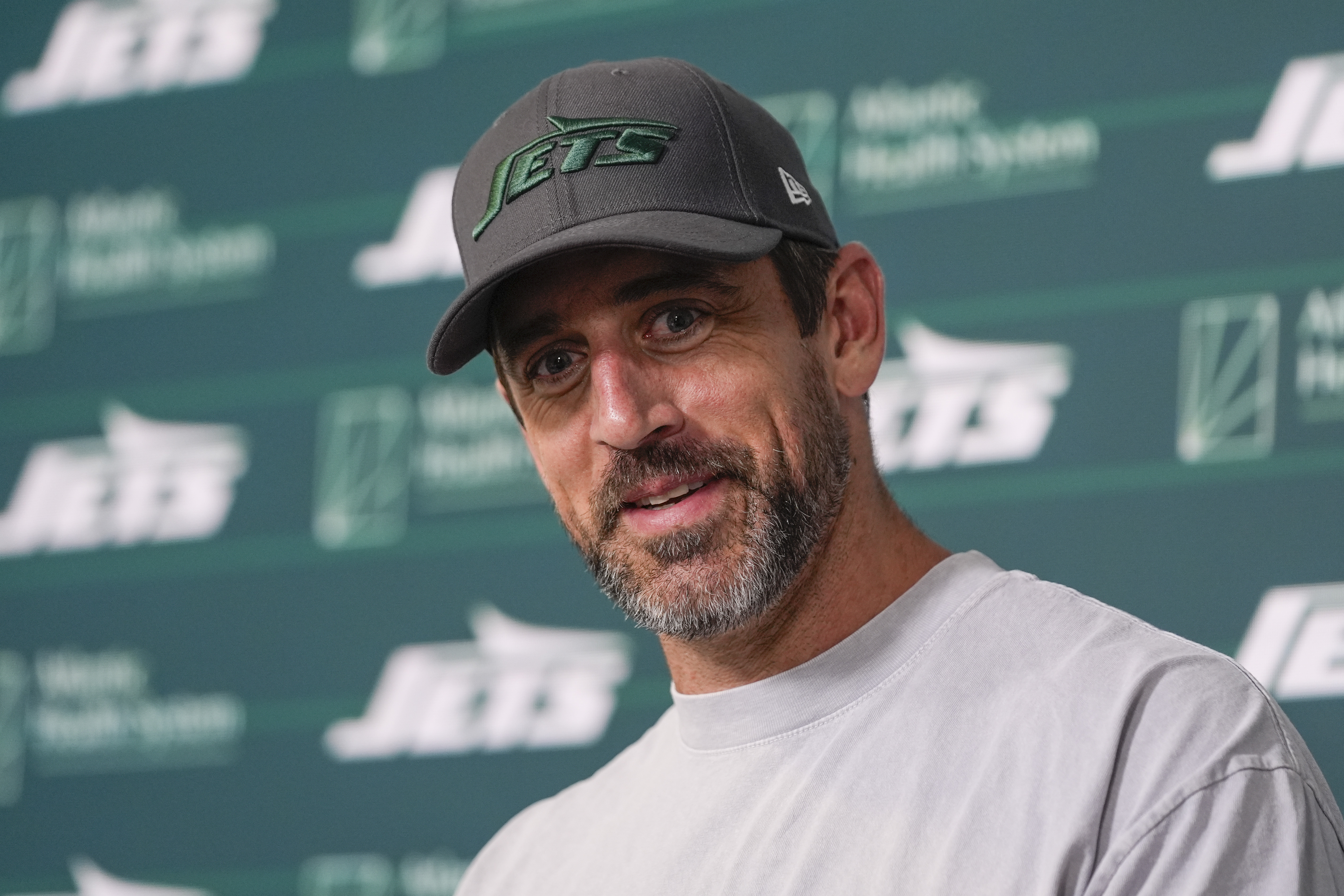 New York Jets quarterback Aaron Rodgers talks to reporters after a practice at the NFL football team's training facility in Florham Park, N.J., Tuesday, May 21, 2024.