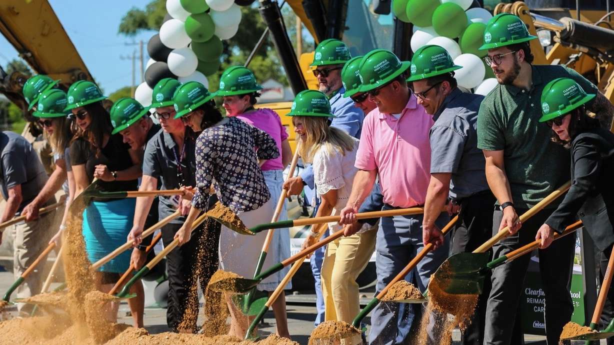 Officials from Davis School District and Clearfield High School and others ceremonially break ground Monday on a planned addition to Clearfield High.