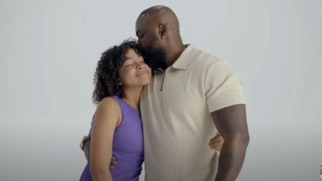 A father and daughter embrace in a new political ad for Democratic Senate candidate Caroline Gleich.