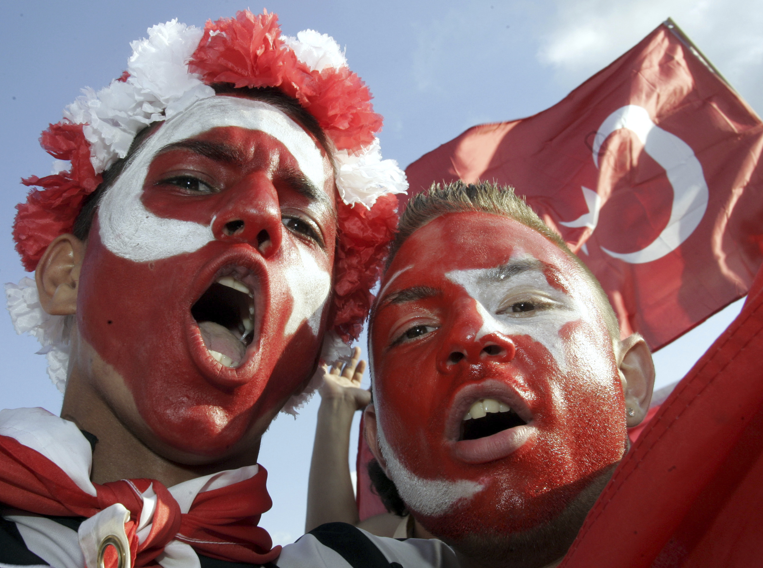 FILE -Turkey's fans celebrate at the KoelnArena-Dome prior to the soccer EURO 2008 semi-final match between Germany and Turkey in Cologne, western Germany, Thursday afternoon, June 25, 2008. “In Germany we’re going to be like a host country,” Turkey defender Ozan Kabak, who was born in Turkey but plays his club soccer in Germany, said in a recent interview. “A lot of Turkish people live here, and I think whole stadiums (are) going to be full of Turkish people." Fans of the Turkish team even outnumbered Germany’s supporters at the friendly in Berlin last year. 
