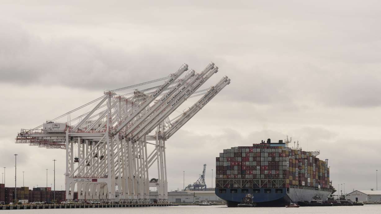 Tugboats escort the cargo ship Dali after it was refloated in Baltimore, May 20. The vessel on March 26 struck the Francis Scott Key Bridge causing it to collapse and resulting in the death of six people.