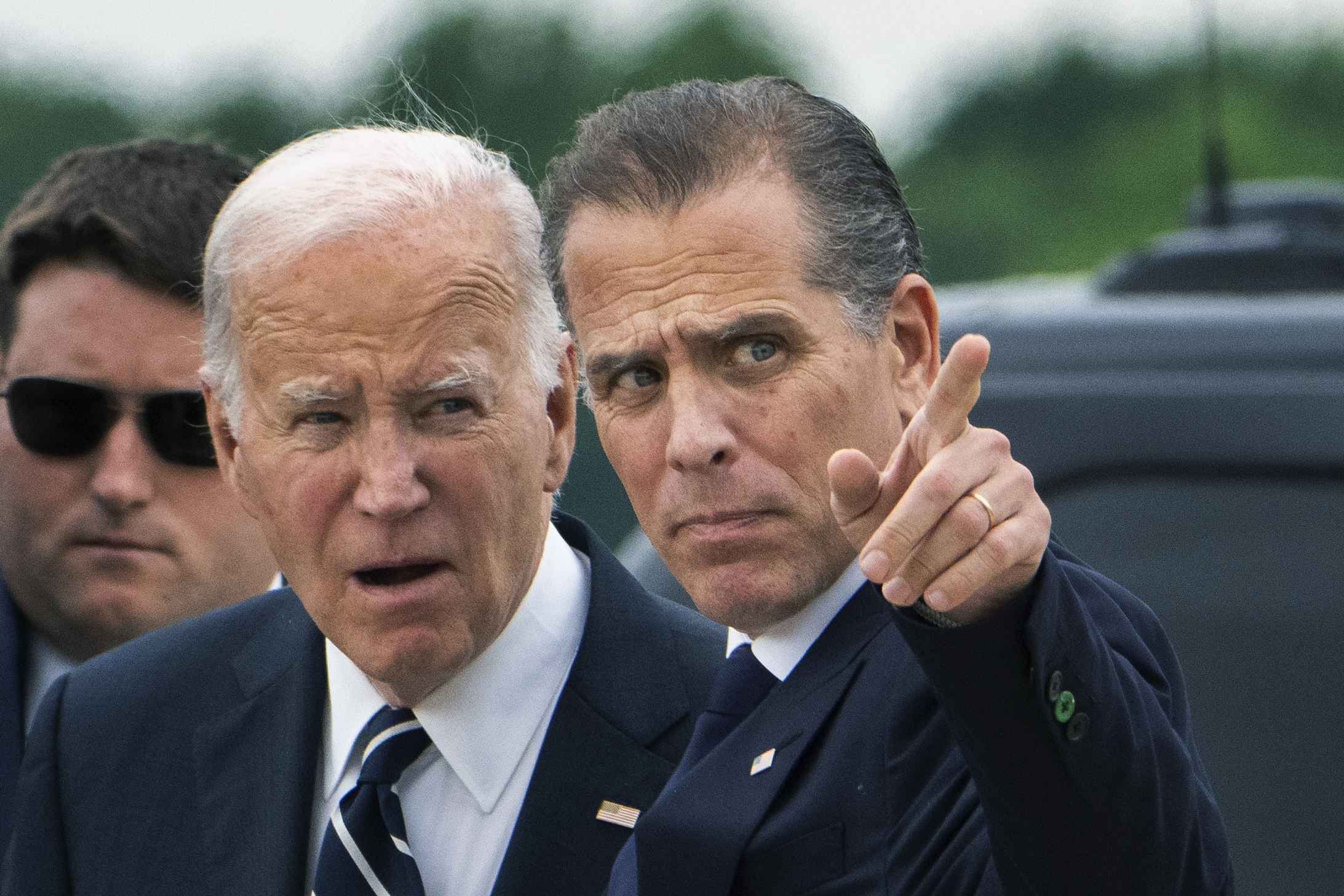 President Joe Biden talks with his son Hunter Biden as he arrives Delaware Air National Guard Base in New Castle, Del., Tuesday. The White House isn't ruling out a potential commutation for Hunter Biden.