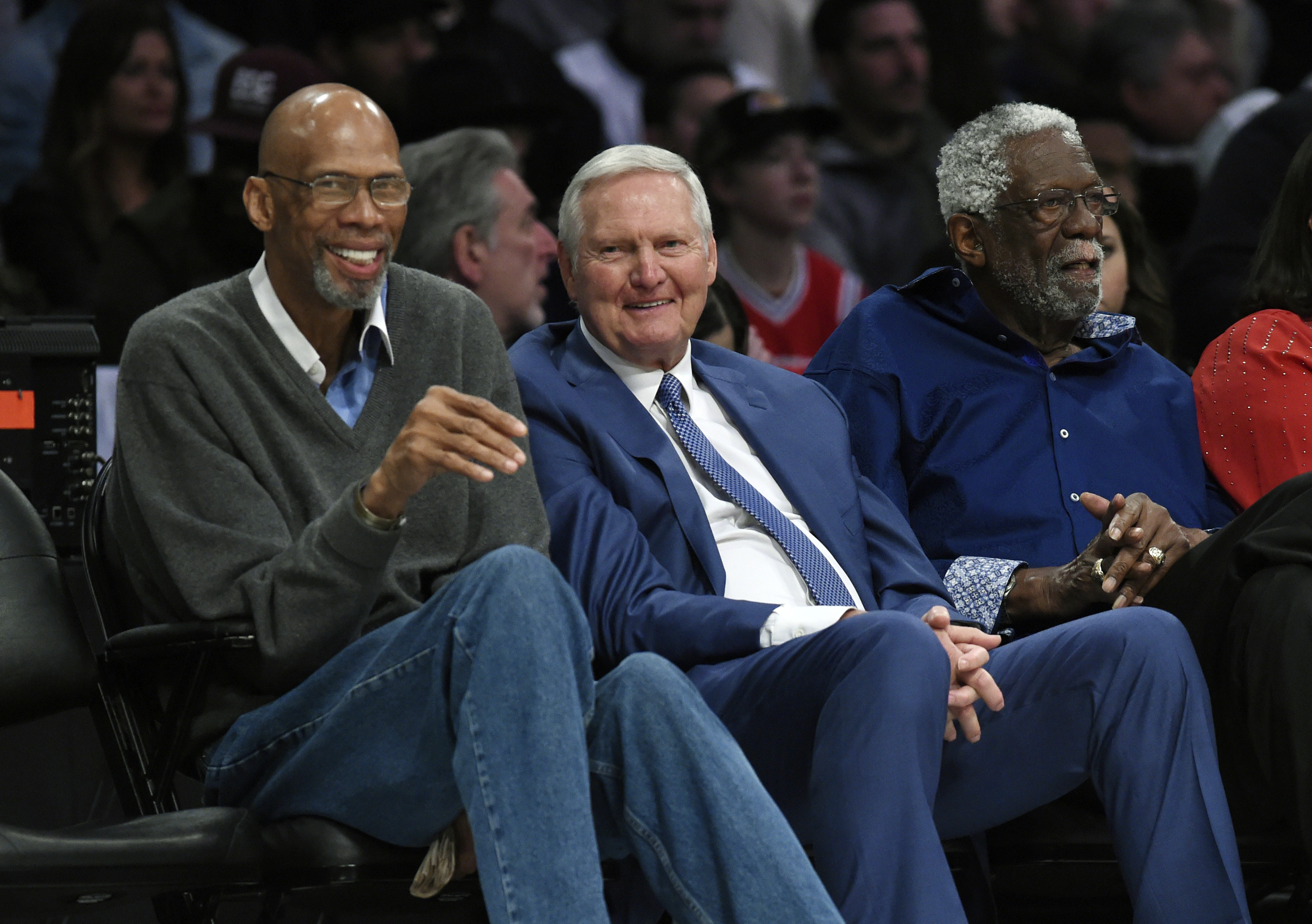 FILE - Former basketball players, from left, Kareem Abdul-Jabbar, Jerry West and Bill Russell watch during the first half of an NBA All-Star basketball game, Sunday, Feb. 18, 2018, in Los Angeles. Jerry West, who was selected to the Basketball Hall of Fame three times in a storied career as a player and executive and whose silhouette is considered to be the basis of the NBA logo, died Wednesday morning, June 12, 2024, the Los Angeles Clippers announced. He was 86.