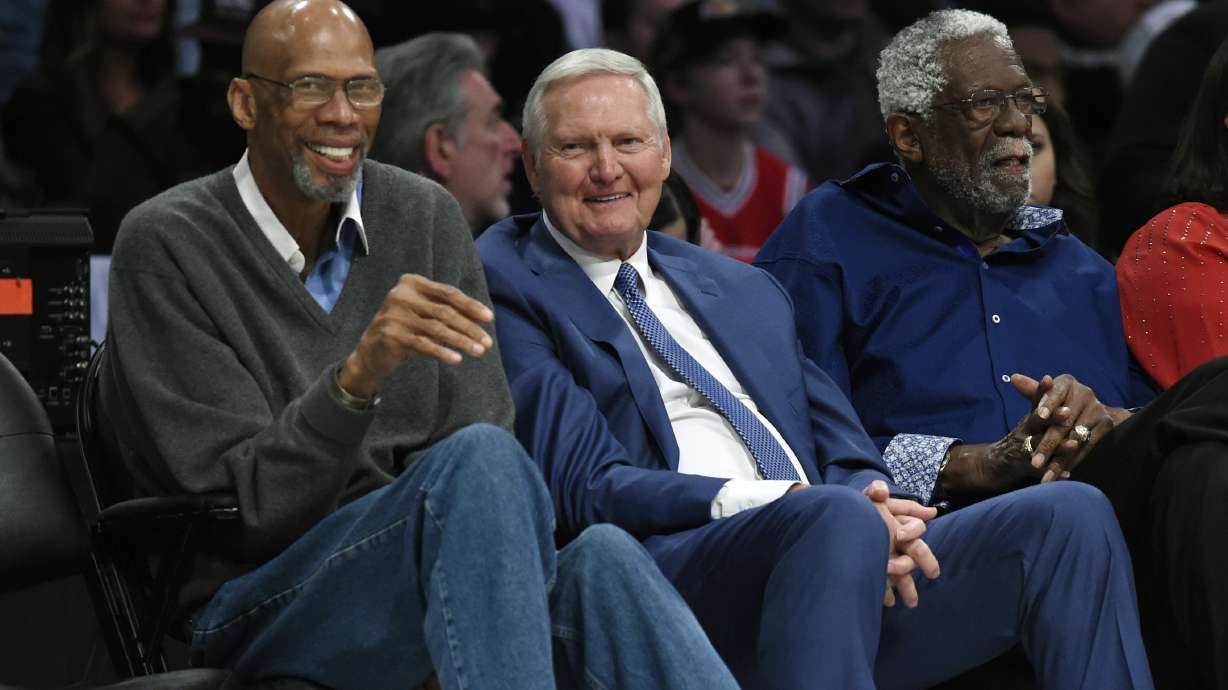 FILE - Former basketball players, from left, Kareem Abdul-Jabbar, Jerry West and Bill Russell watch during the first half of an NBA All-Star basketball game, Sunday, Feb. 18, 2018, in Los Angeles. Jerry West, who was selected to the Basketball Hall of Fame three times in a storied career as a player and executive and whose silhouette is considered to be the basis of the NBA logo, died Wednesday morning, June 12, 2024, the Los Angeles Clippers announced. He was 86.