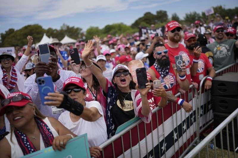 People cheer as Republican presidential candidate, former President Donald Trump speaks at a campaign rally Sunday in Las Vegas.