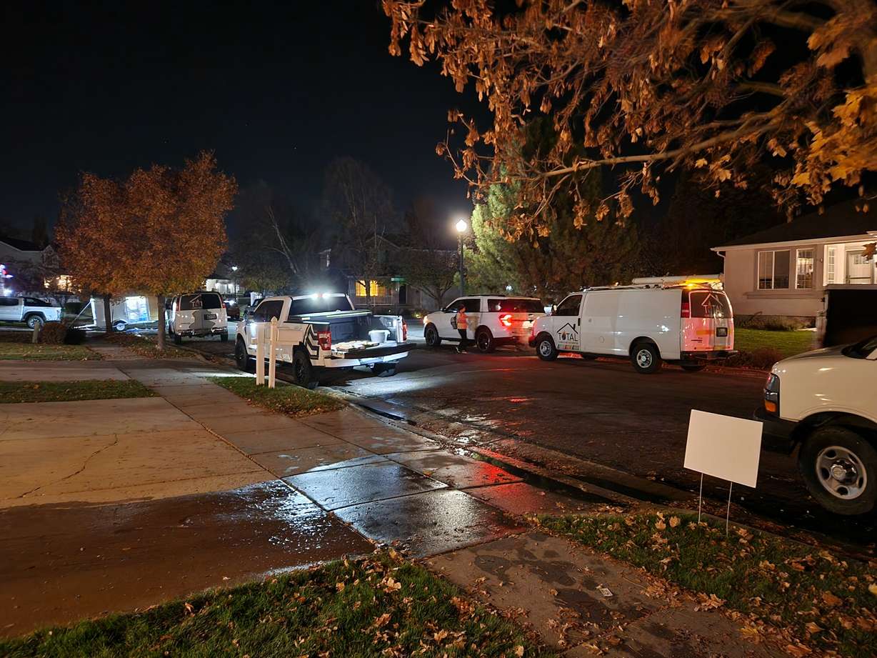 A Farmington neighborhood, filled with trucks to remove sewer water from residents' basements, Nov. 10, 2023.