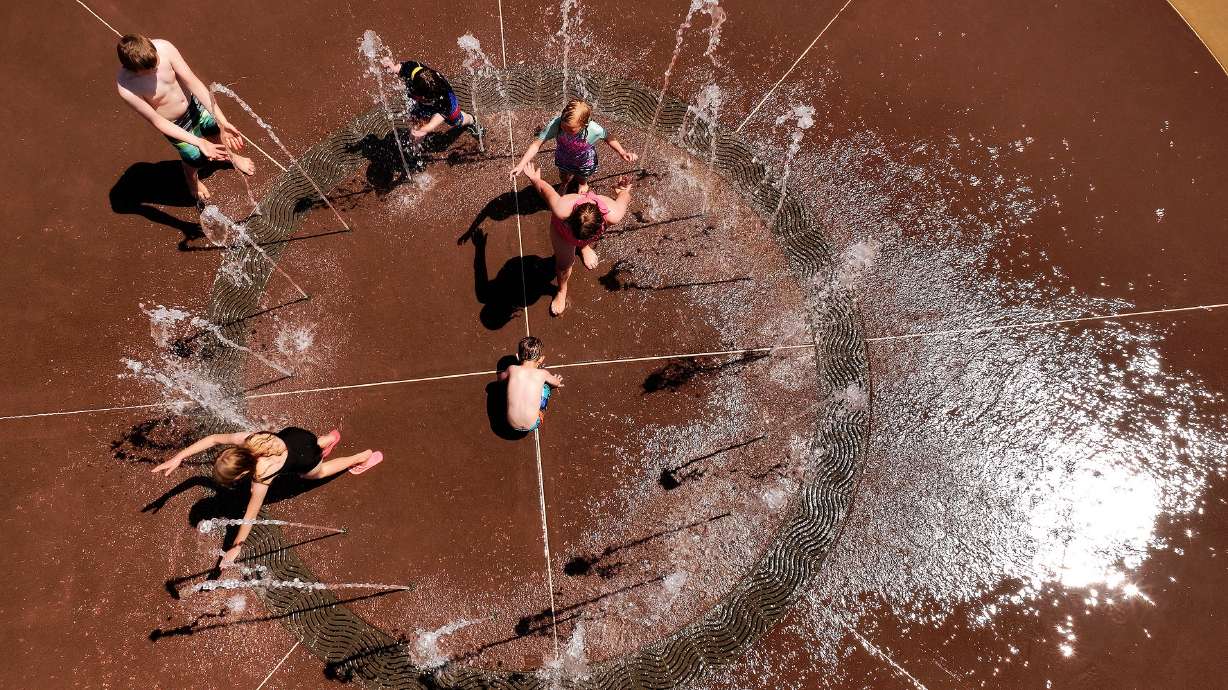 Children play in the water at the Foxboro North Regional Park splash pad in North Salt Lake on June 12. Multiple Utah cities posted above-normal average temperatures, but relief is expected in the first week of July in parts of Utah, including on the Fourth of July.