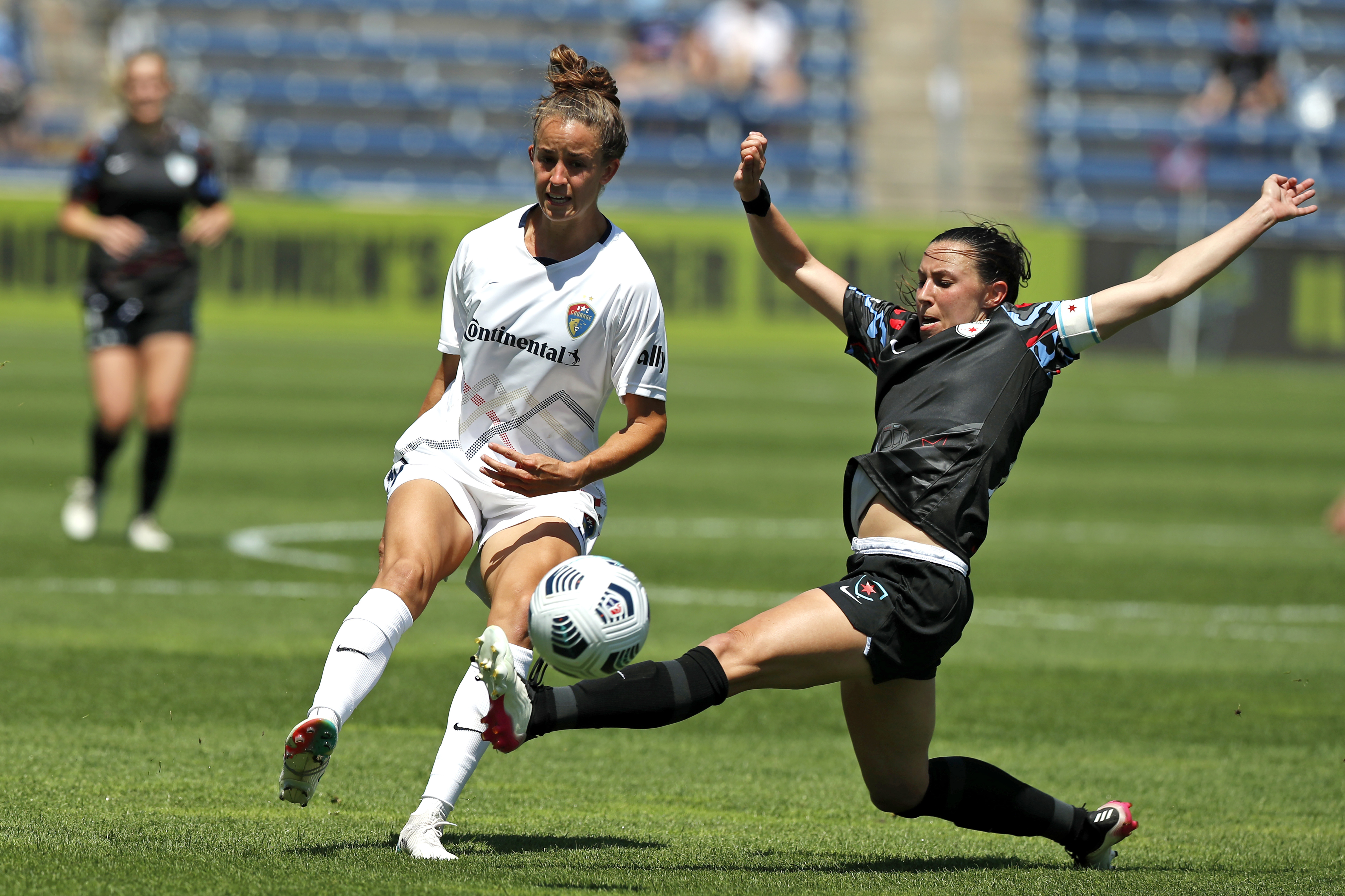FILE - Chicago Red Stars midfielder Vanessa DiBernardo, right, lunges for the ball against North Carolina Courage midfielder Havana Solaun during the second half of an NWSL soccer match June 5, 2021, in Bridgeview, Ill. The Red Stars are looking for an alternative venue for their Sept. 21 home game against the San Diego Wave because of a just-announced music festival at SeatGeek Stadium in Bridgeview. 