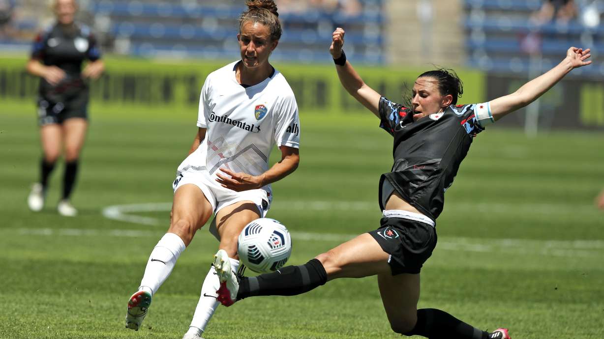 FILE - Chicago Red Stars midfielder Vanessa DiBernardo, right, lunges for the ball against North Carolina Courage midfielder Havana Solaun during the second half of an NWSL soccer match June 5, 2021, in Bridgeview, Ill. The Red Stars are looking for an alternative venue for their Sept. 21 home game against the San Diego Wave because of a just-announced music festival at SeatGeek Stadium in Bridgeview.