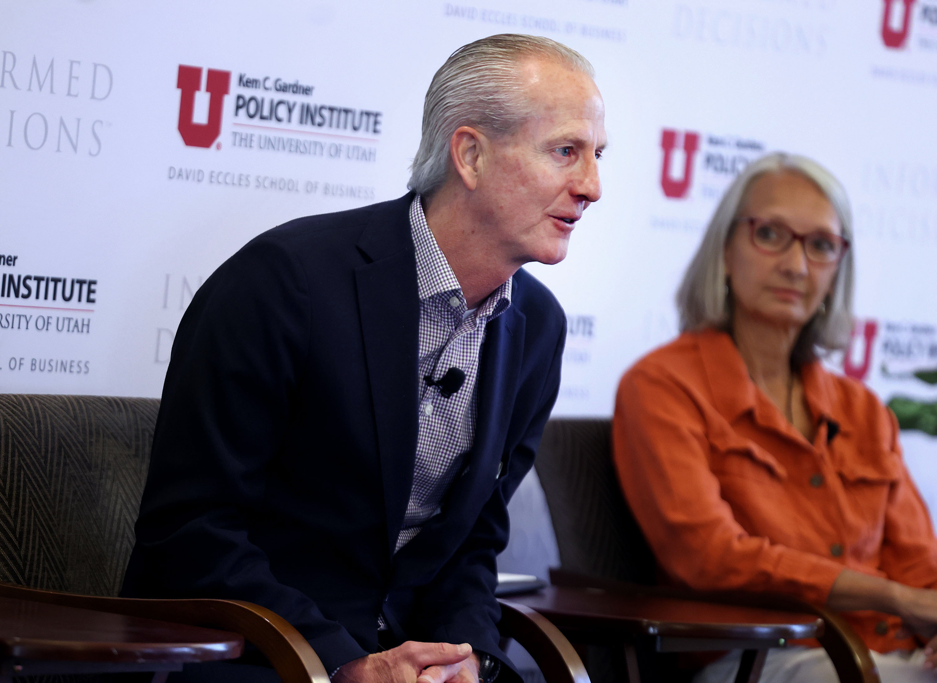 Wayne Niederhauser, Utah Homeless Services director, and Carol Hollowell, executive director of homeless services provider Switchpoint, speak during a Gardner Institute Newsmaker Breakfast on homelessness in Salt Lake City on Wednesday.