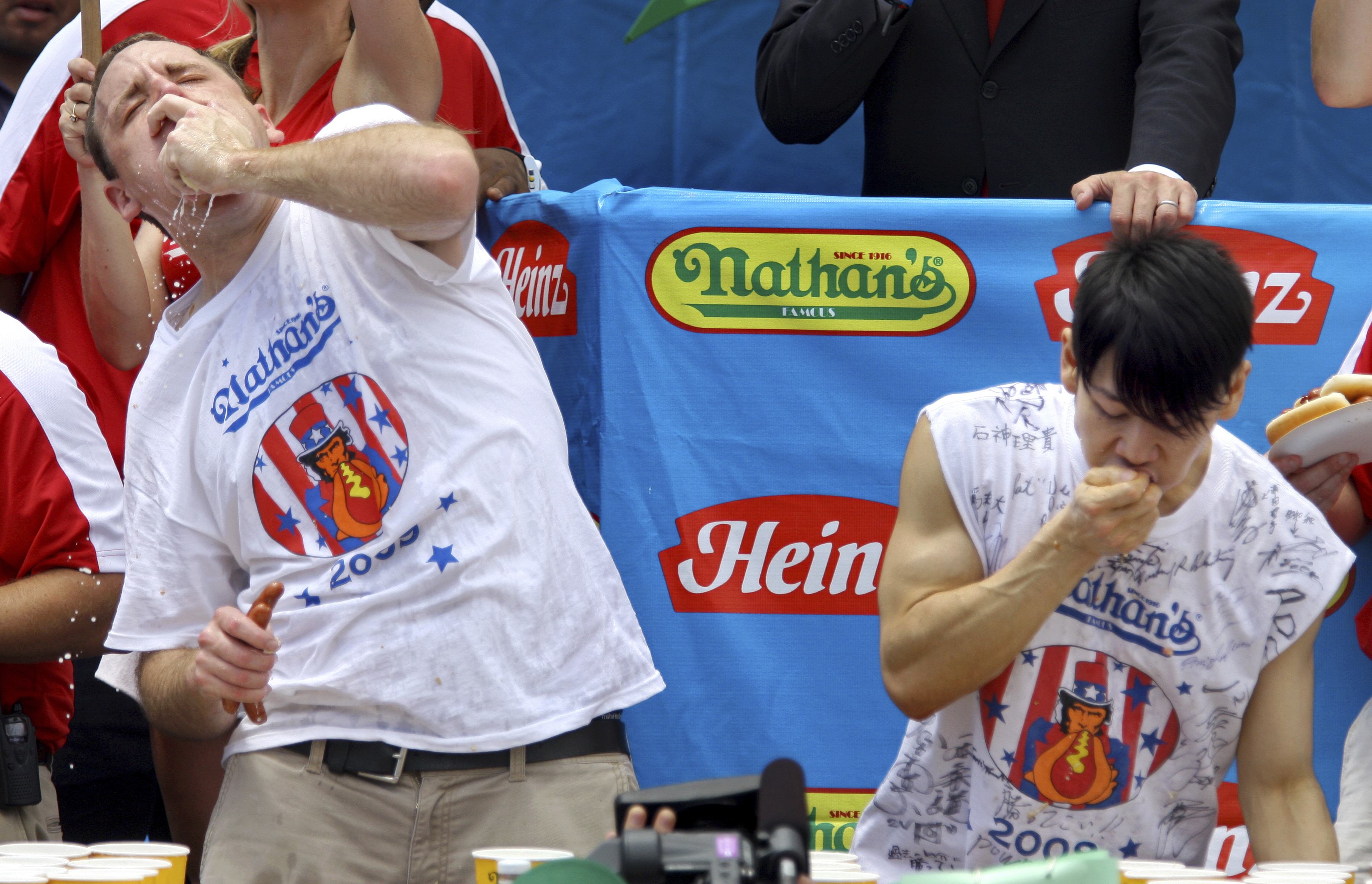 FILE - Joey Chestnut, defending champion of the Nathan’s Famous Fourth of July hot dog eating contest, left, works to outpace former champion Takeru Kobayashi, right, July 4, 2009, in New York. Chestnut, a 16-time hot dog-eating champion, will face off with his frequent Nathan’s competitor, Kobayashi, in a live Netflix special on Sept. 2, 2024, the streamer announced Wednesday, June 12. 