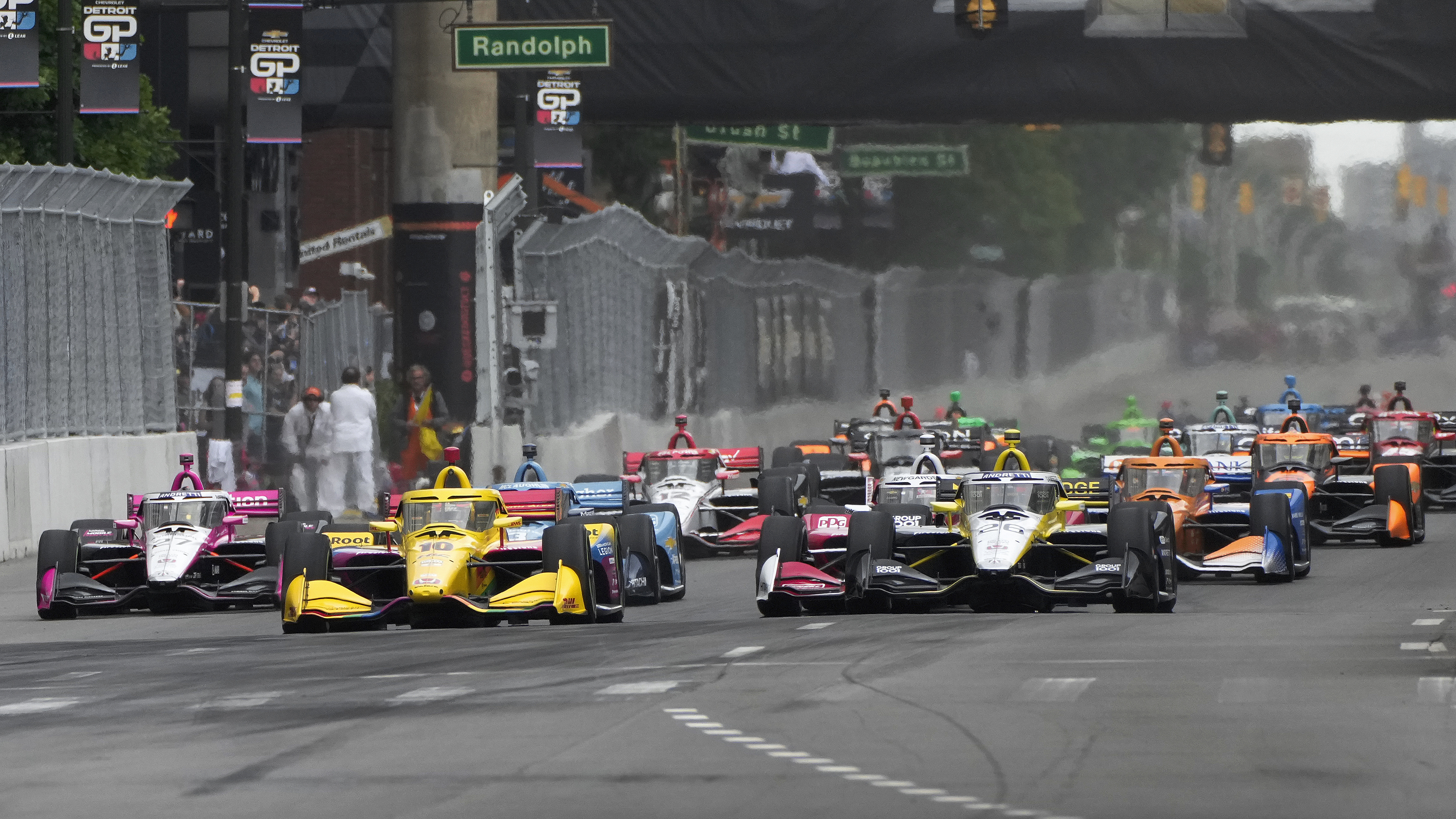 Colton Herta (26) leads the field during the IndyCar Detroit Grand Prix auto race in Detroit, Sunday, June 2, 2024.