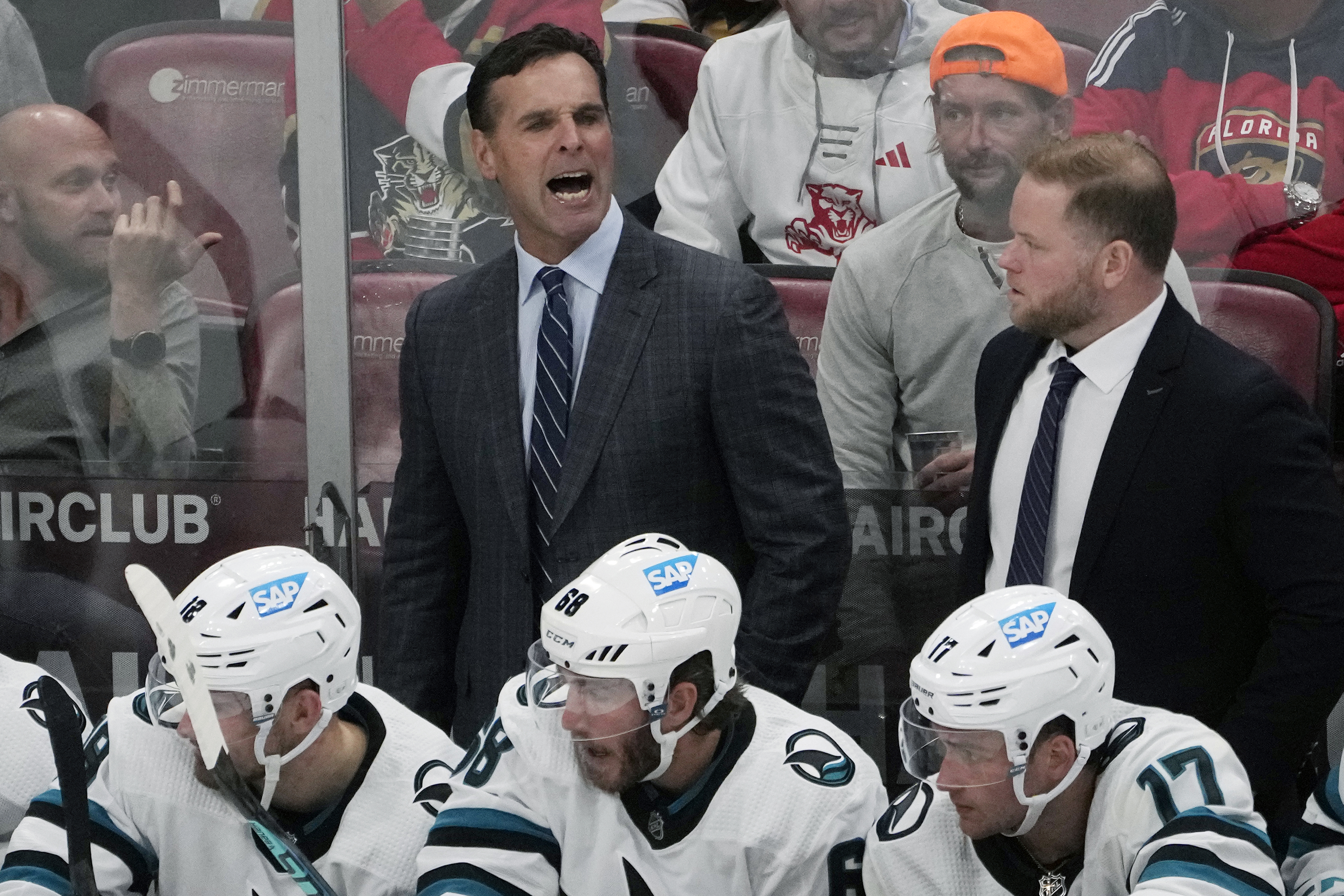FILE -San Jose Sharks head coach David Quinn yells as assistant coach Ryan Warsofsky, right, looks on during the second period of an NHL hockey game against the Florida Panthers, Tuesday, Oct. 24, 2023, in Sunrise, Fla. The San Jose Sharks have promoted Ryan Warsofsky to become the team's new head coach after two years as an assistant under the recently fired David Quinn. General manager Mike Grier announced Thursday, June 13, 2024, that Warsofsky will become the 11th head coach in franchise history.