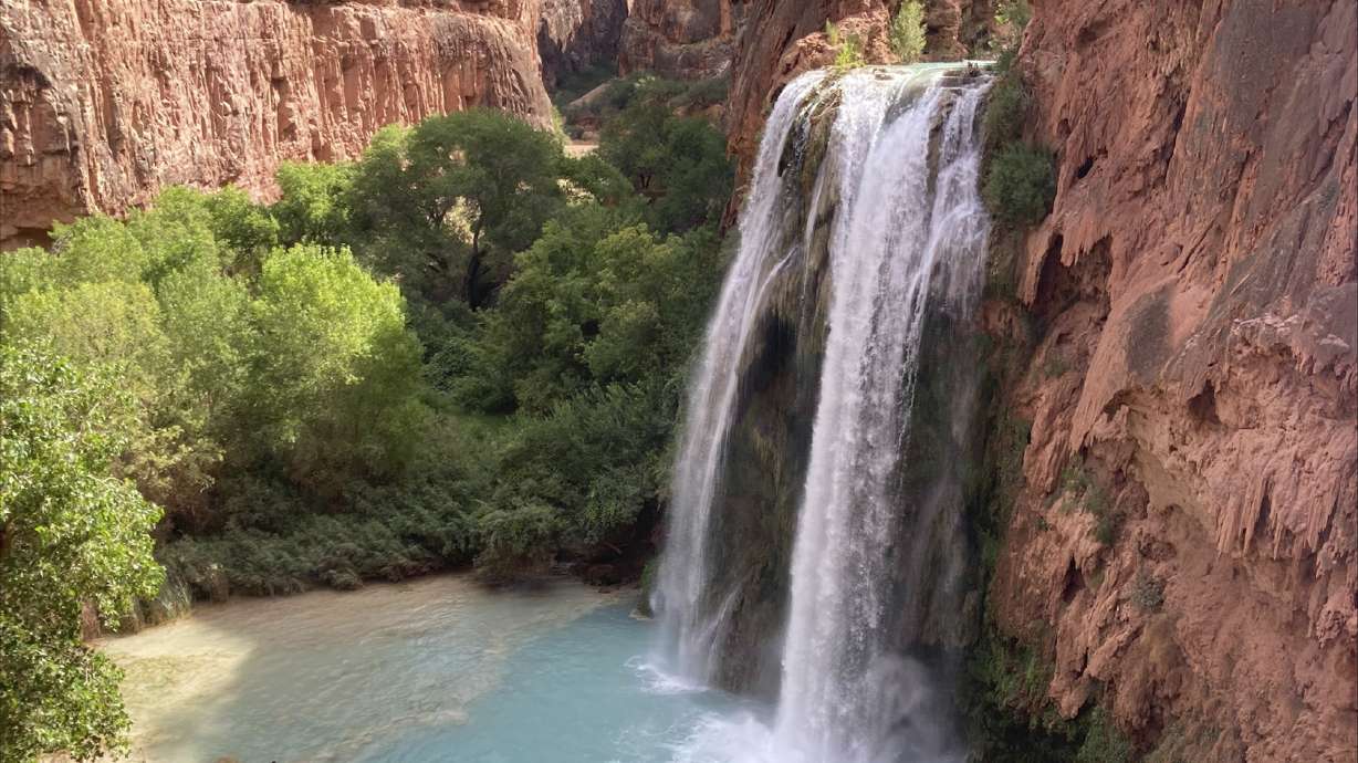 This photo shows the Havasu Falls on the Havasupai reservation in Arizona, Sept. 4, 2023. Dozens of tourists say they fell ill after a visit to the waterfalls deep in a gorge neighboring Grand Canyon National Park.