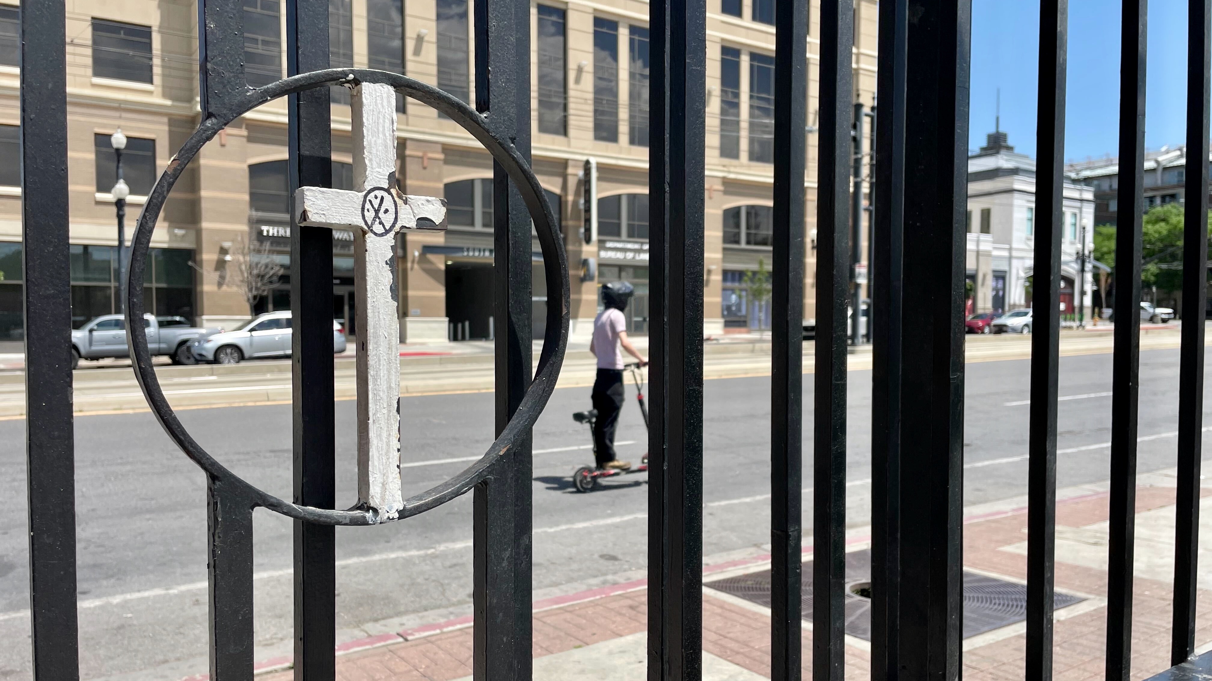 A cross on the gate outside the downtown Salt Lake City offices of Catholic Community Services of Utah, photographed Wednesday.