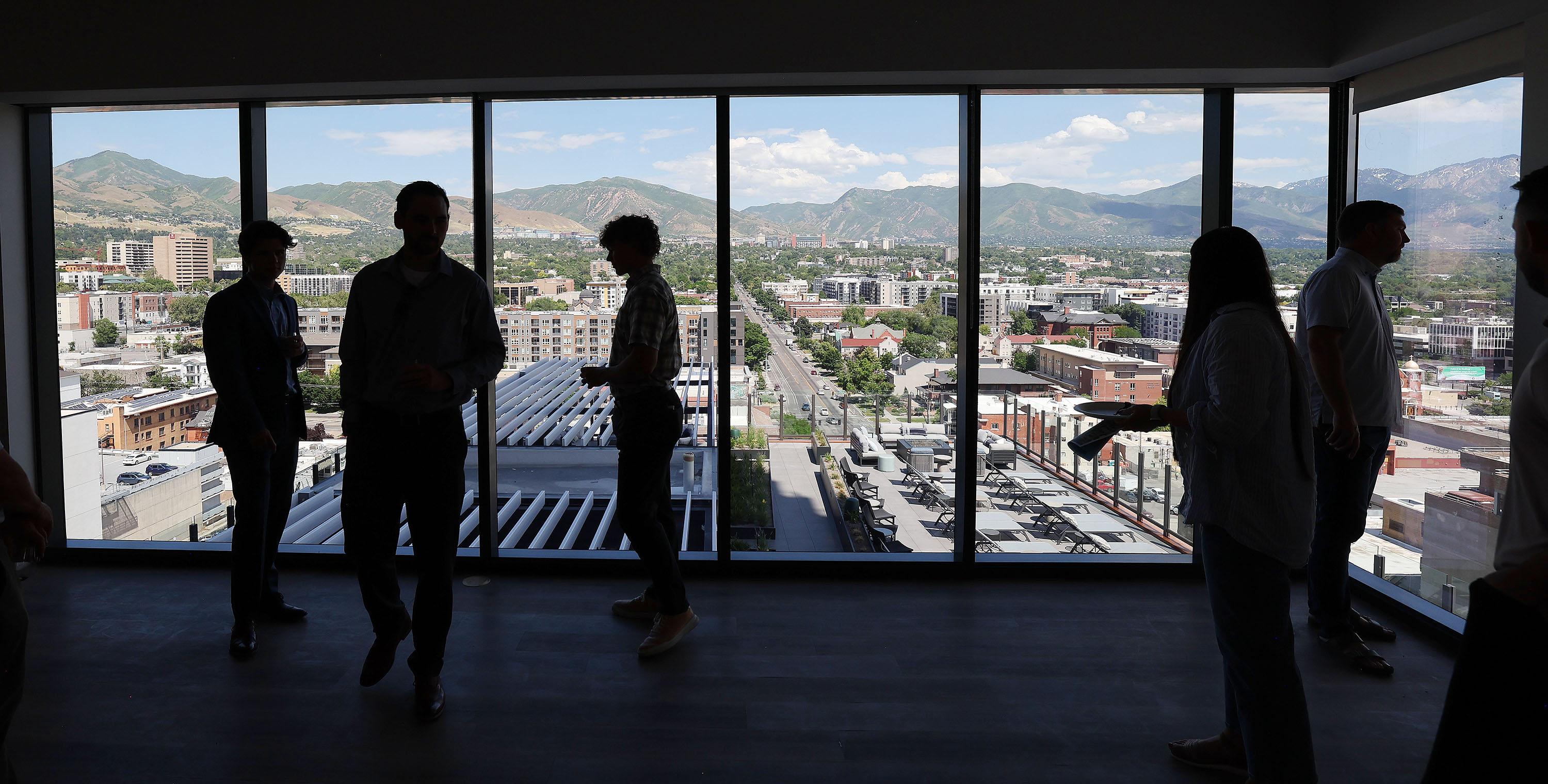 Brokers look over the view as they tour the Worthington Residences in Salt Lake City on Wednesday, when Convexity Properties, a DRW Company and full-service real estate investment firm, announced its grand opening.