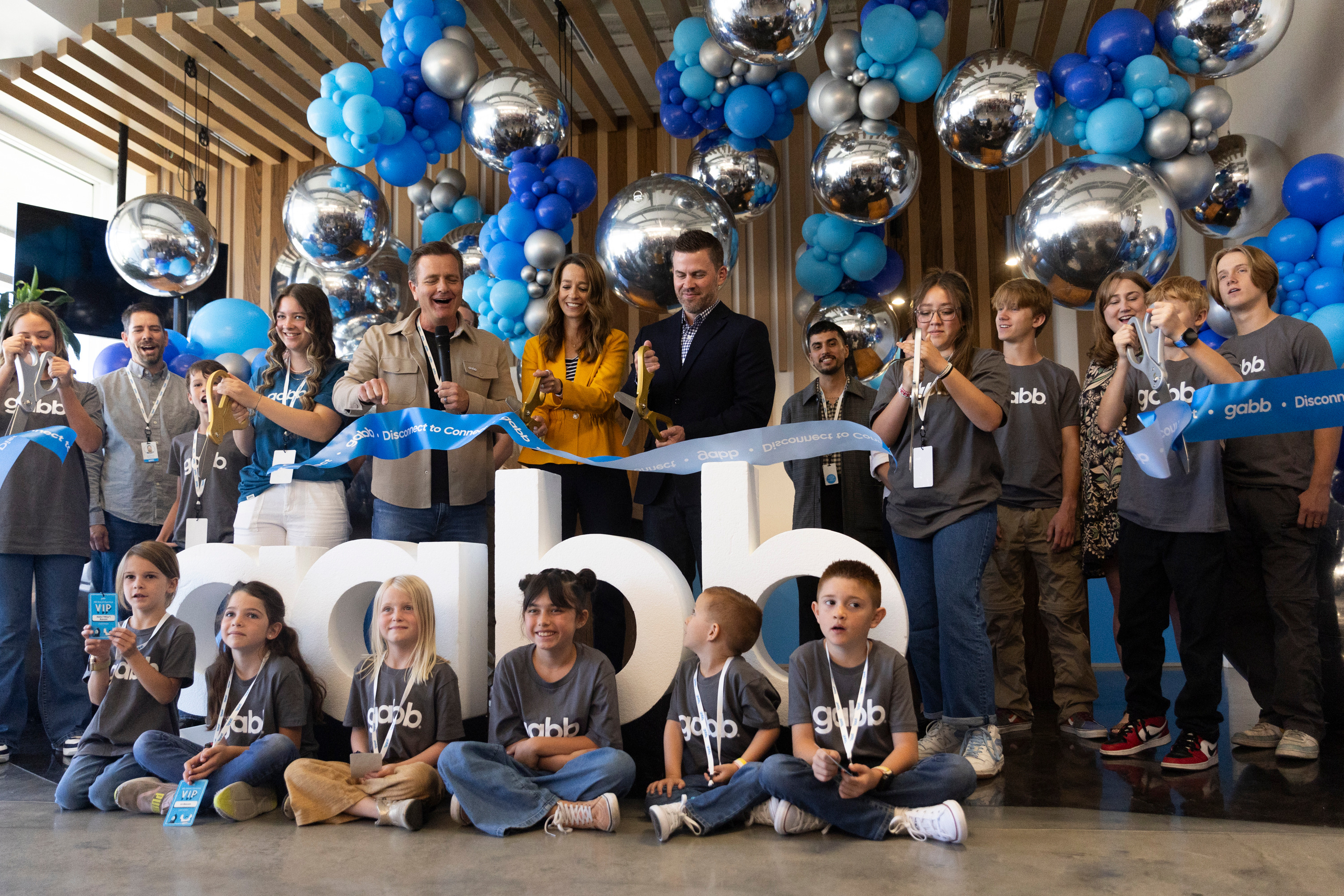 Guests, employees and their families attend a ribbon-cutting ceremony for Gabb Phones at their new headquarters in Lehi on Thursday.